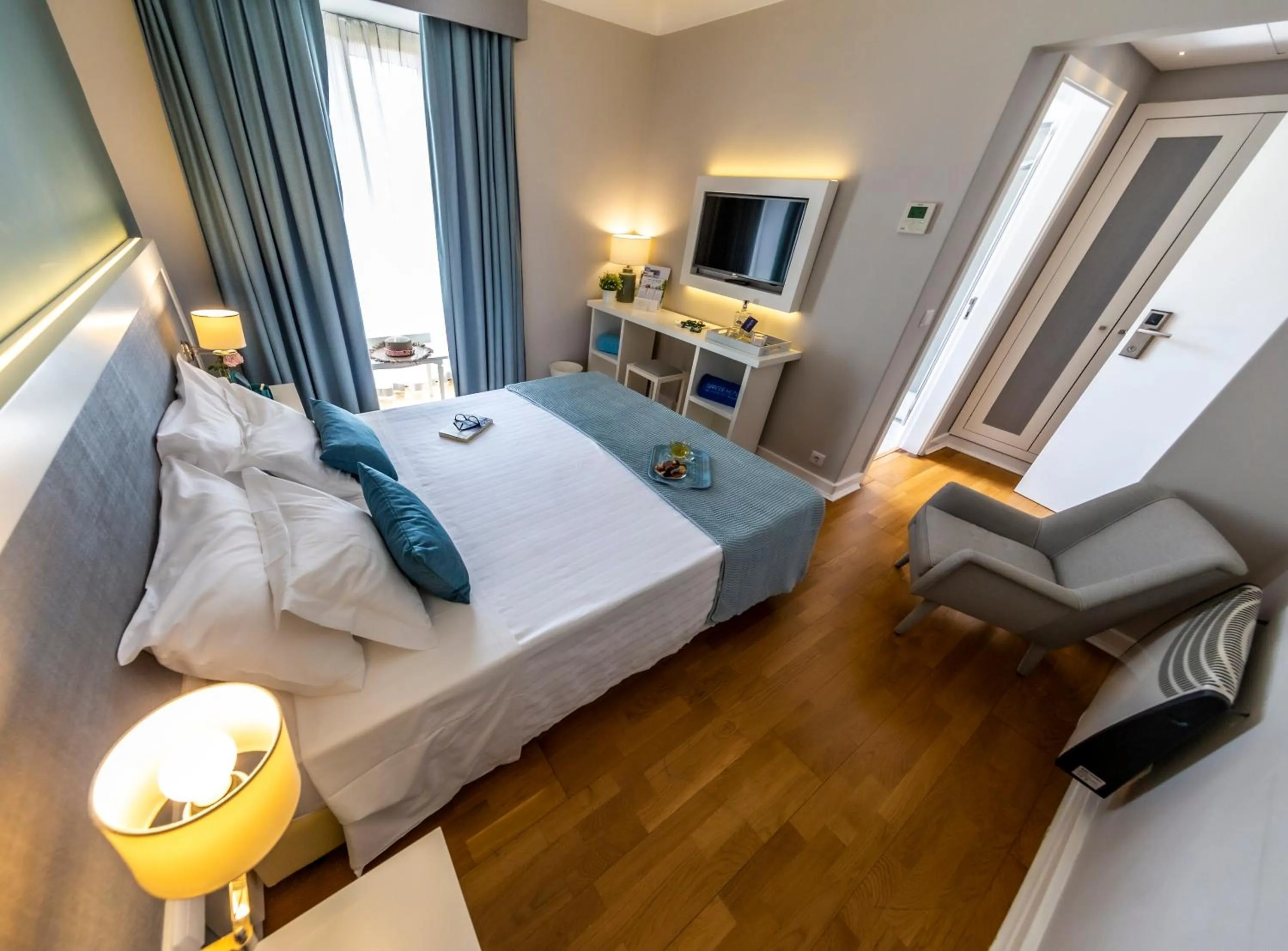 Communal lounge/ TV room, Bed in Grande Hotel das Caldas da Felgueira