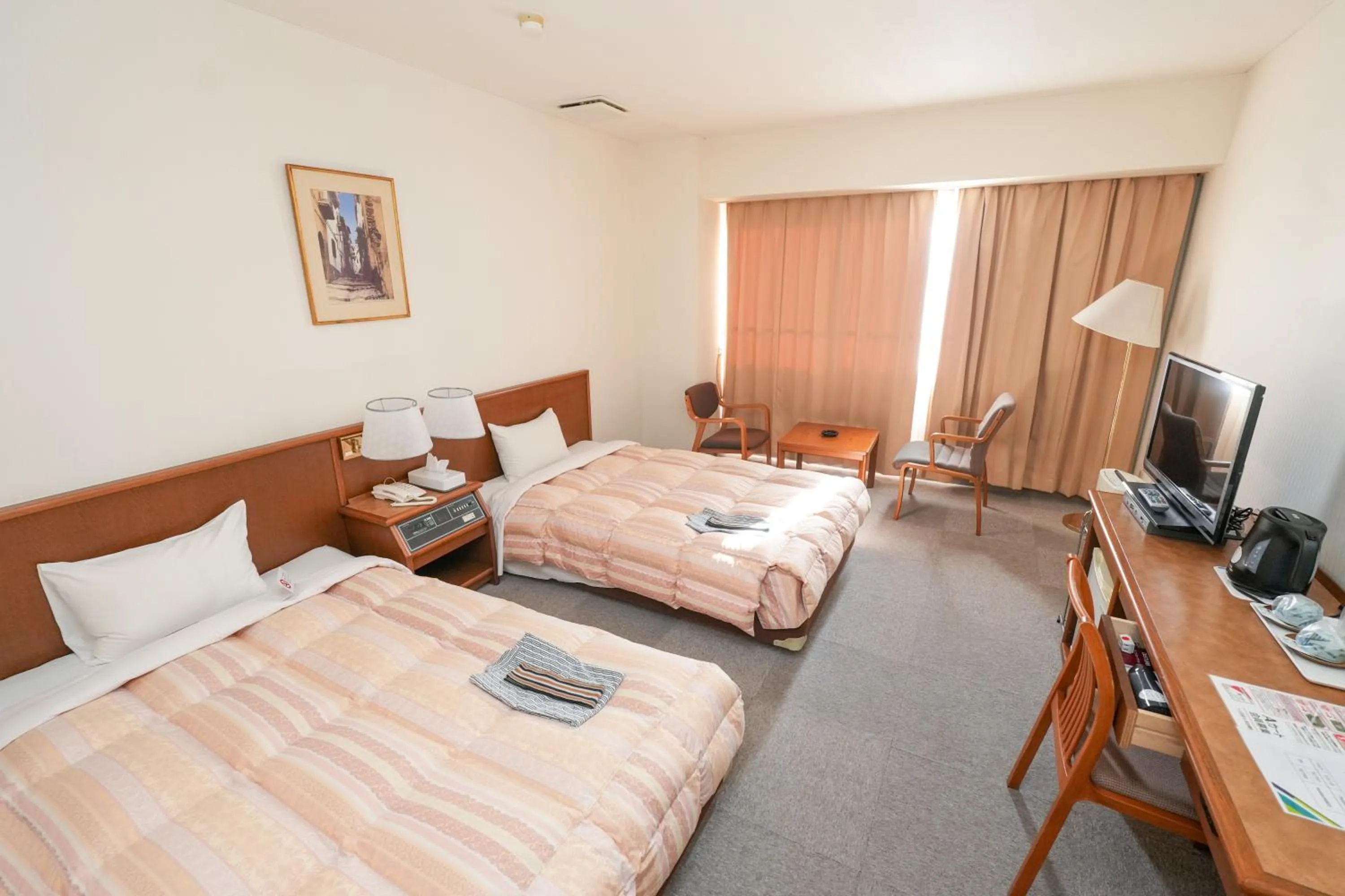 Bed in Tendo Central Hotel