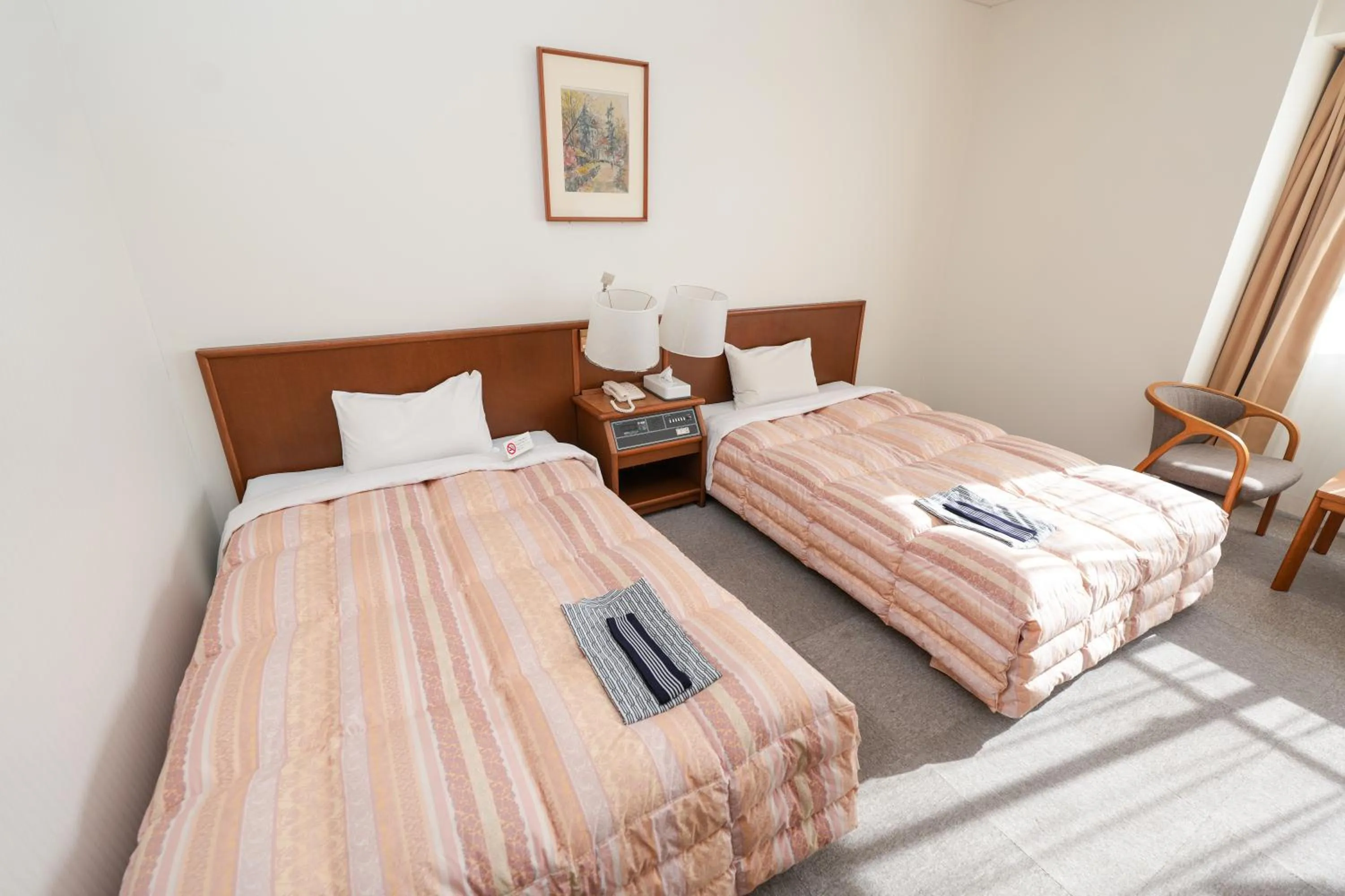 Bed in Tendo Central Hotel