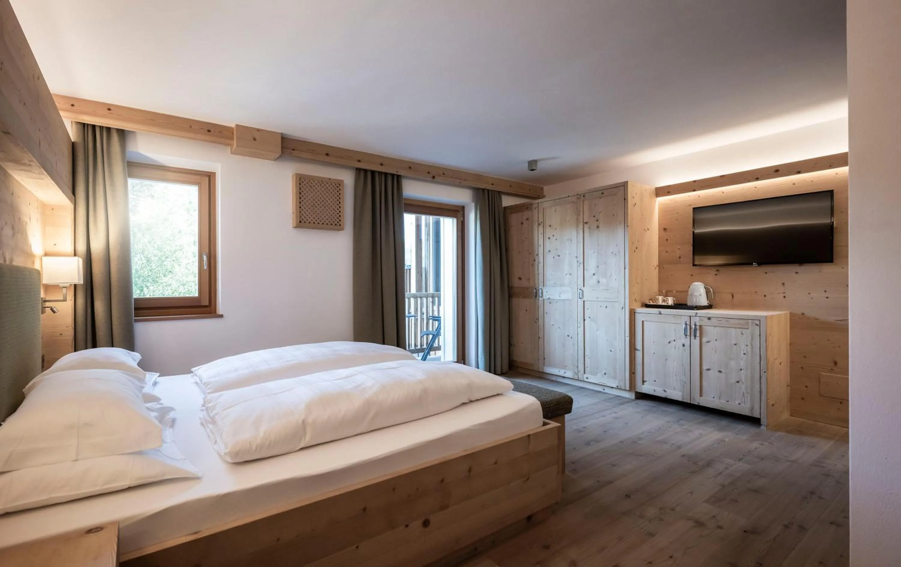 Photo of the whole room, Bed in Dolomites Nature Hotel Vigilerhof