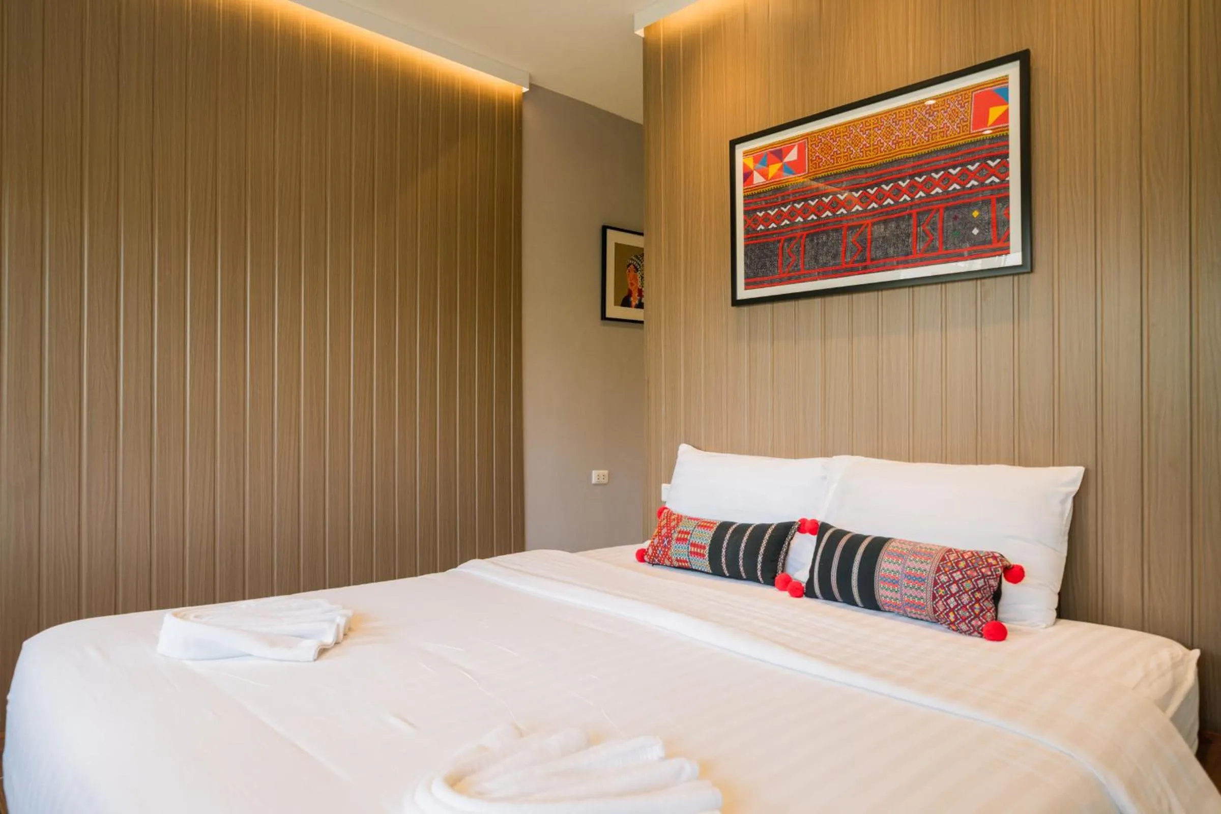 Bed in The Opium Chiang Mai