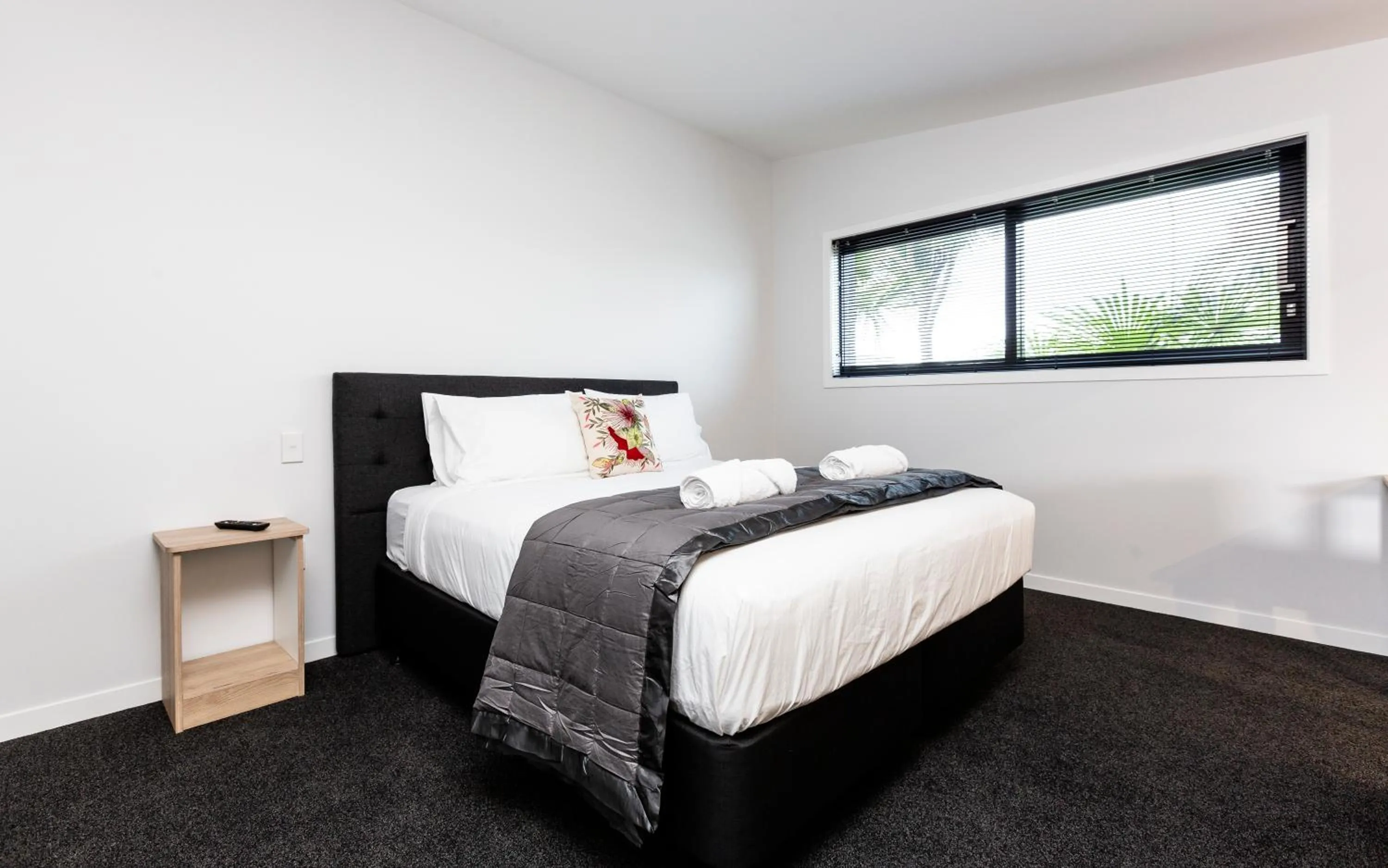 Bed in Zachary's Motel