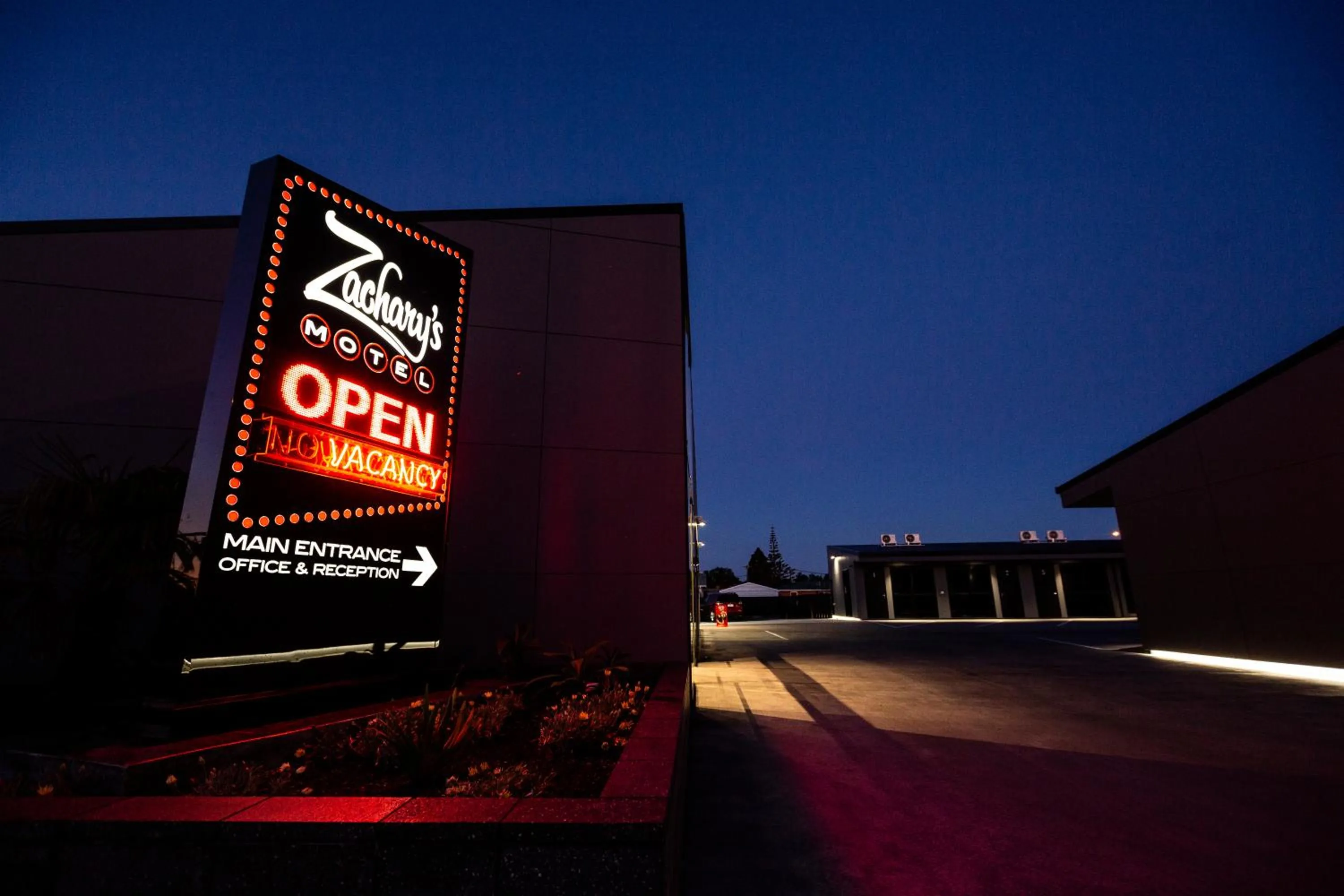 Property logo or sign in Zachary's Motel