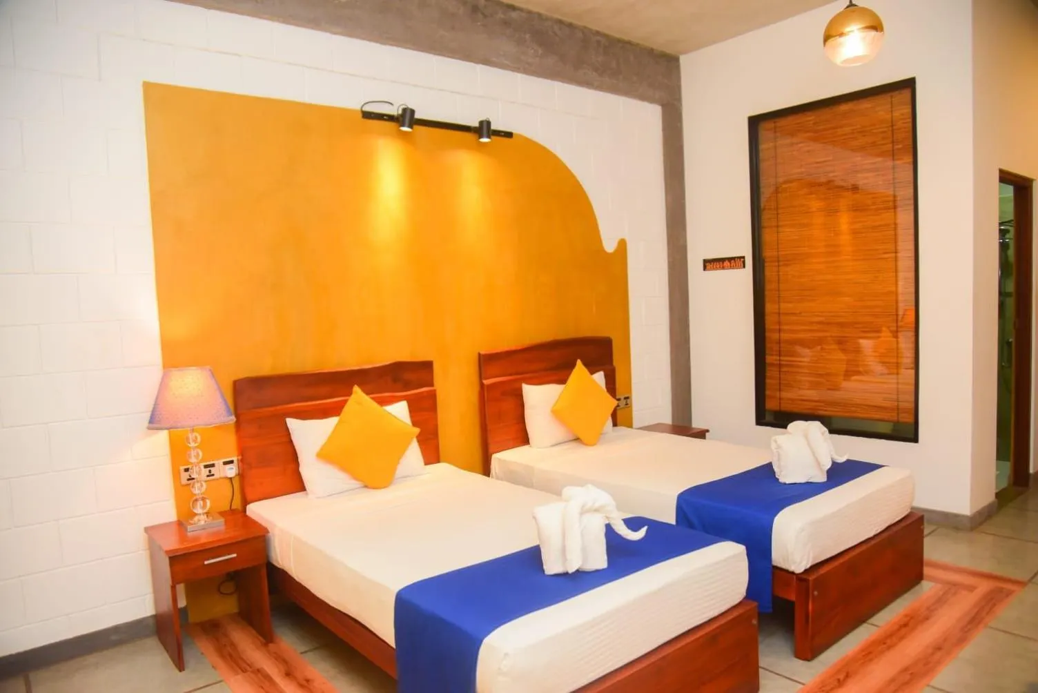 Bed in Royal Tusker Hotel