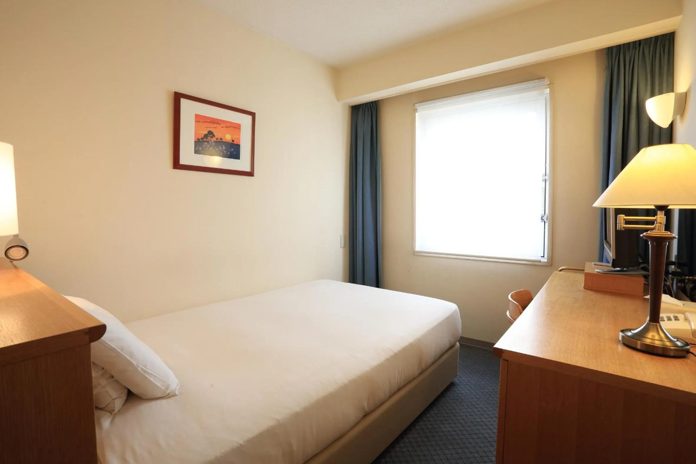 Bed in Smile Hotel Tomakomai