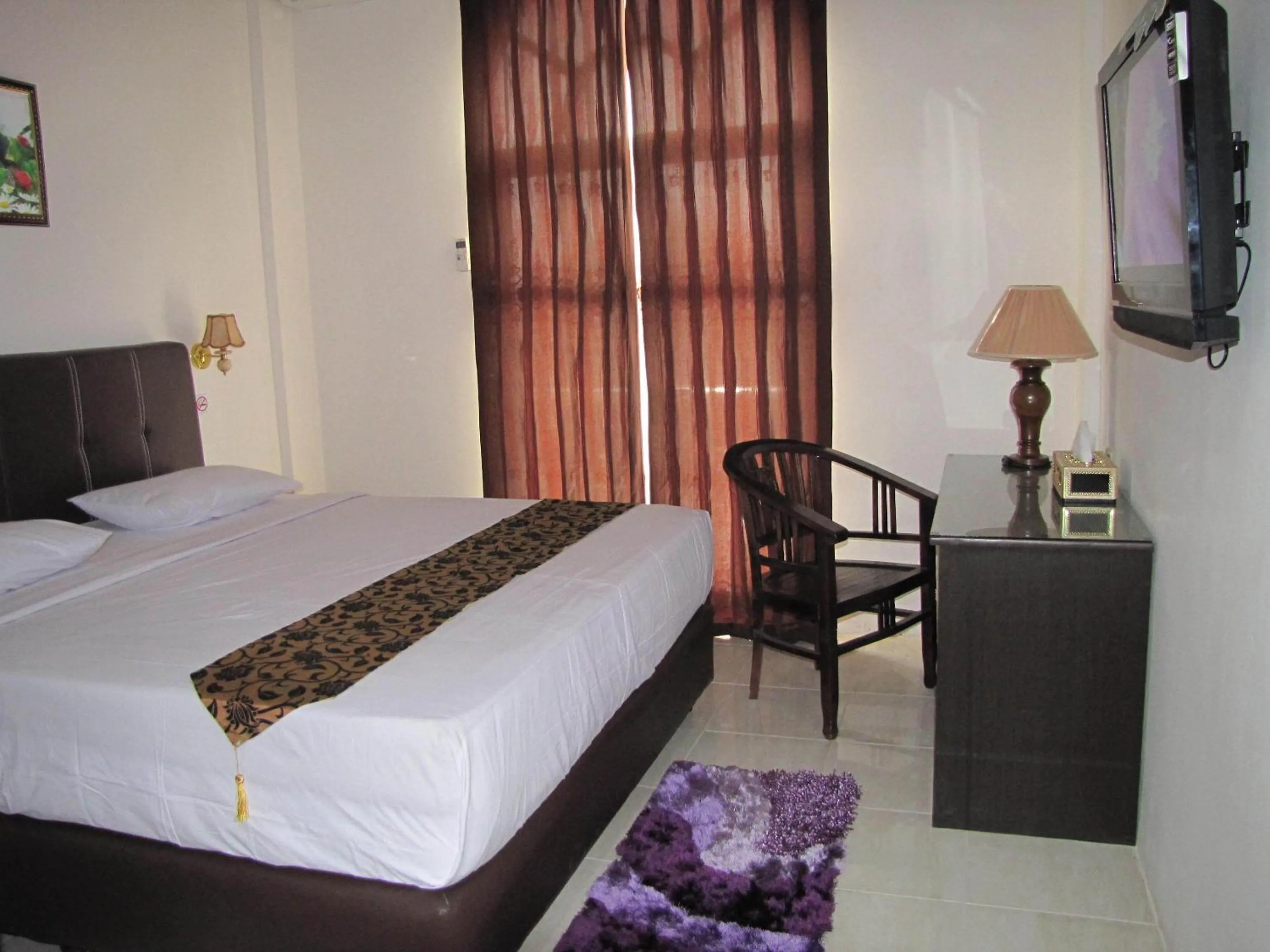 Bed in Hotel Mitra Garden