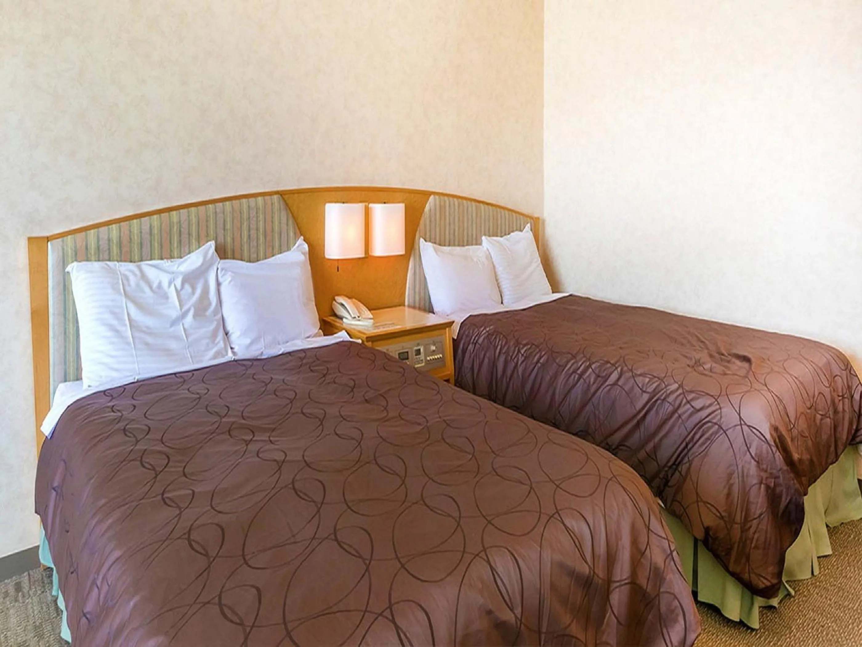 Bed in LiVEMAX RESORT Hakodate Greenpia Onuma