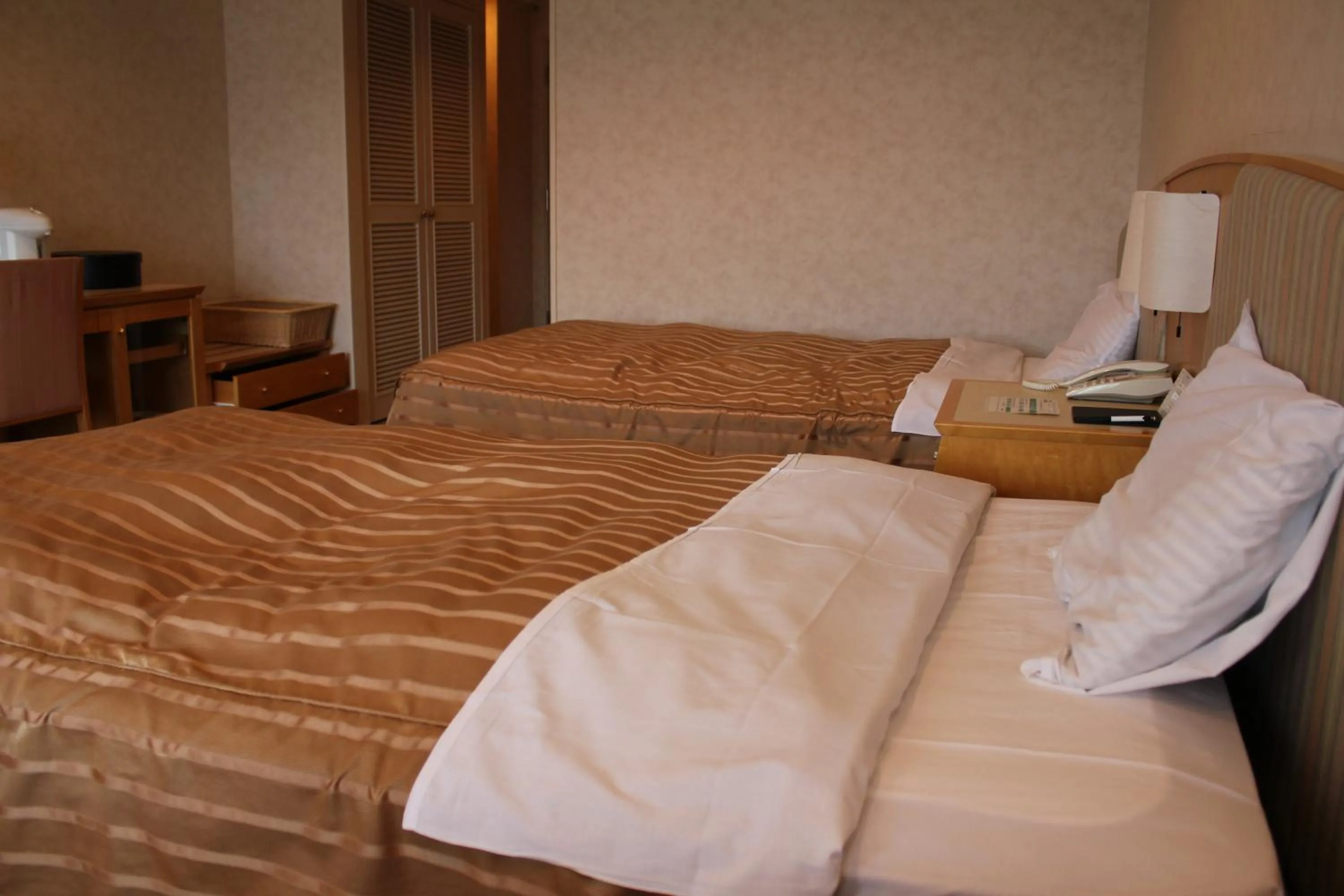 Bed in LiVEMAX RESORT Hakodate Greenpia Onuma