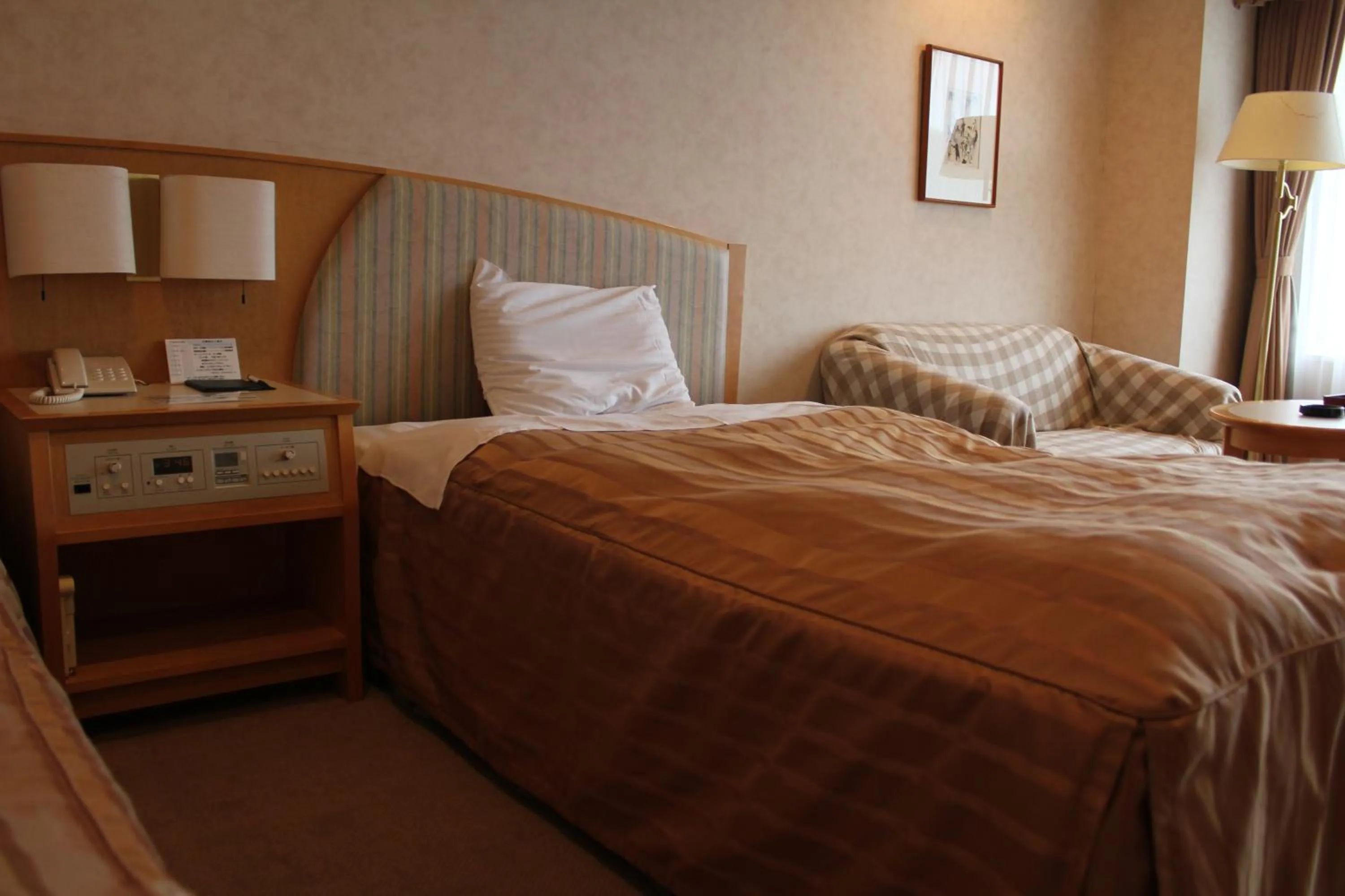 Bed in LiVEMAX RESORT Hakodate Greenpia Onuma