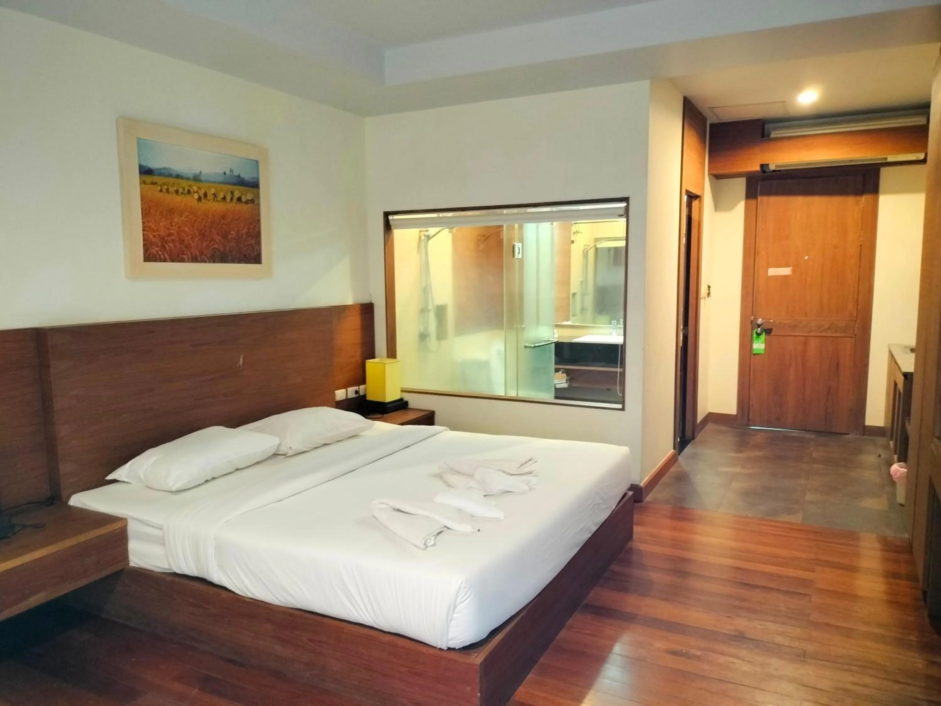 Bed in Baan Saikao Plaza Hotel & Service Apartment