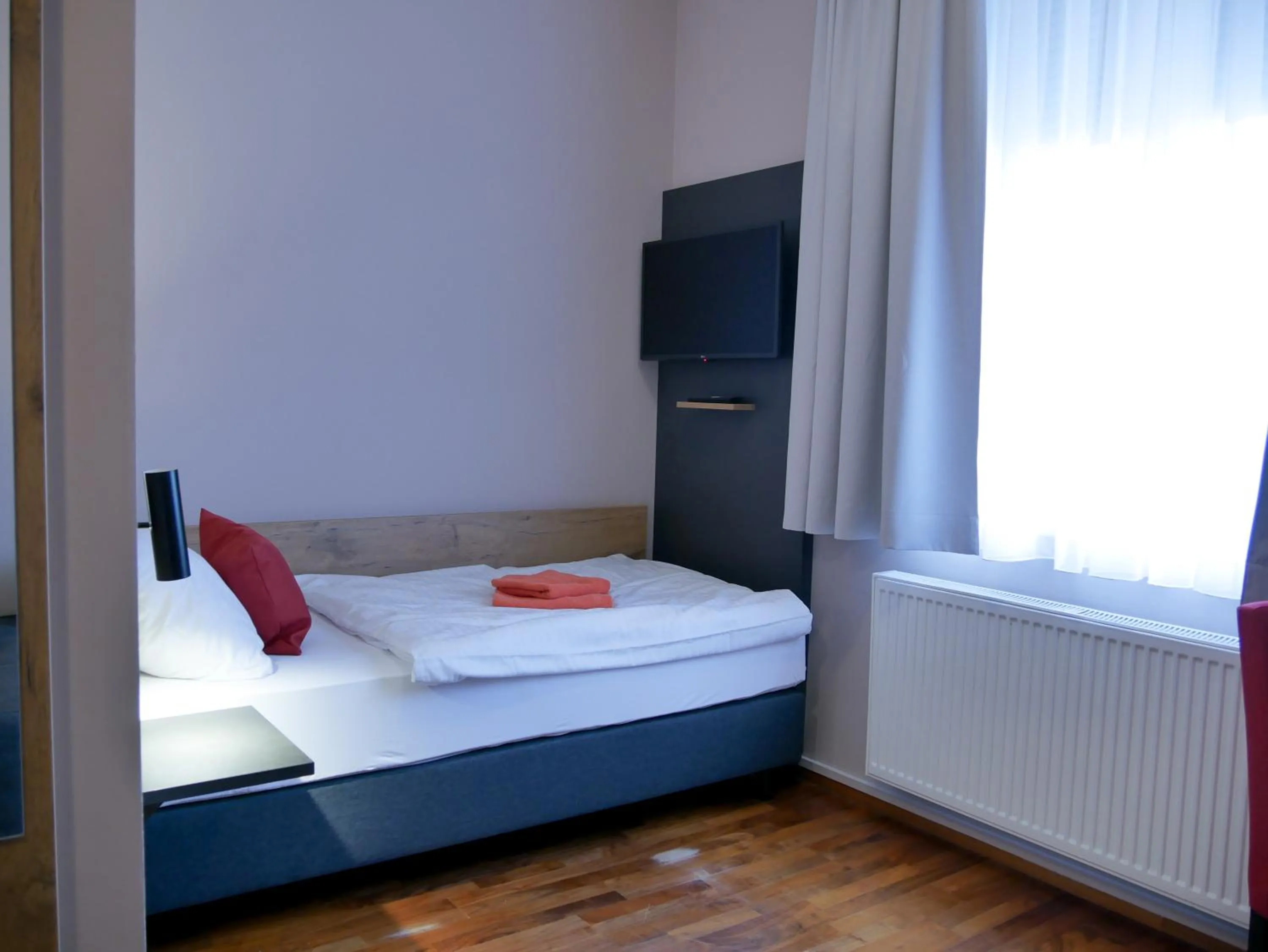 Bed in Hotel Linde-Sinohaus