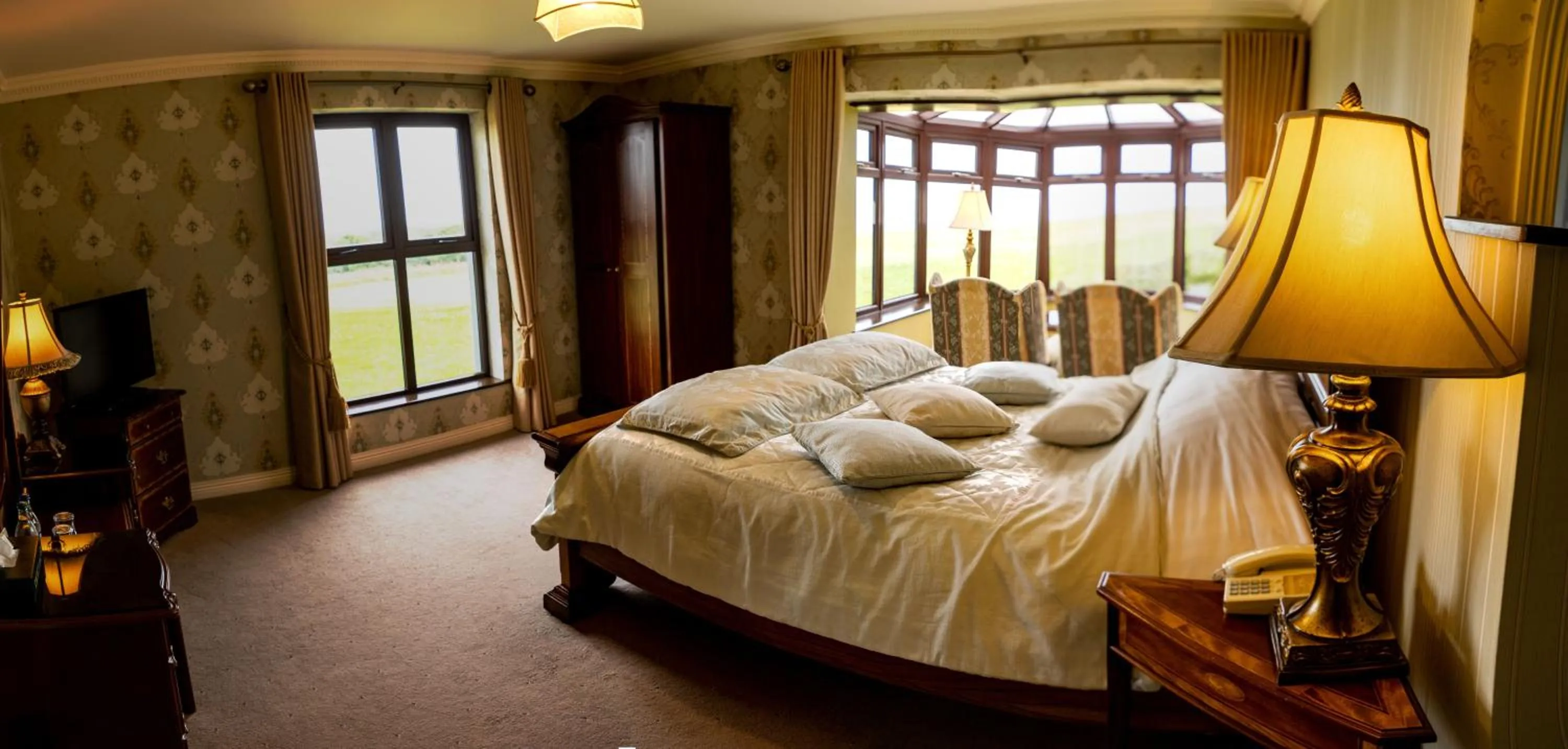 Bed in Ballinalacken Castle Country House Hotel