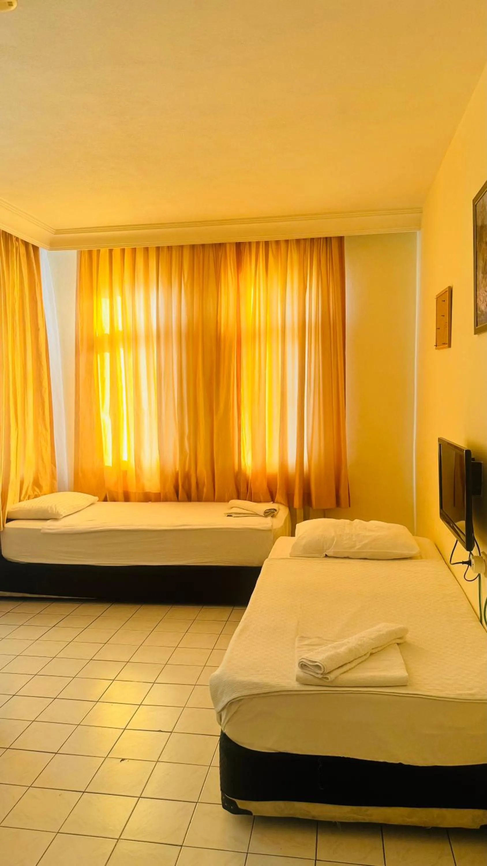 Bed in Baronessa Apart Hotel