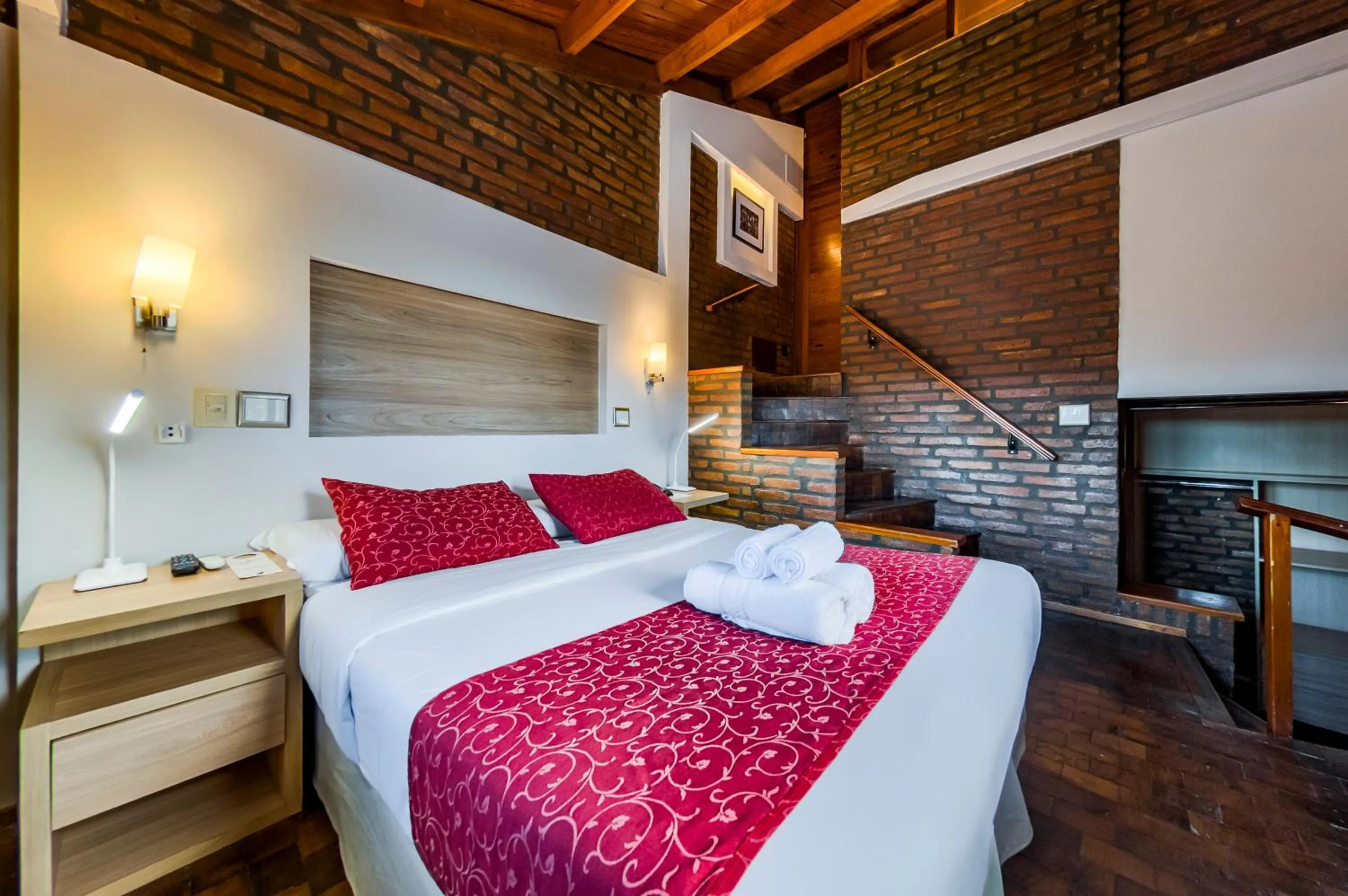 Bed in Portal del Lago Hotel