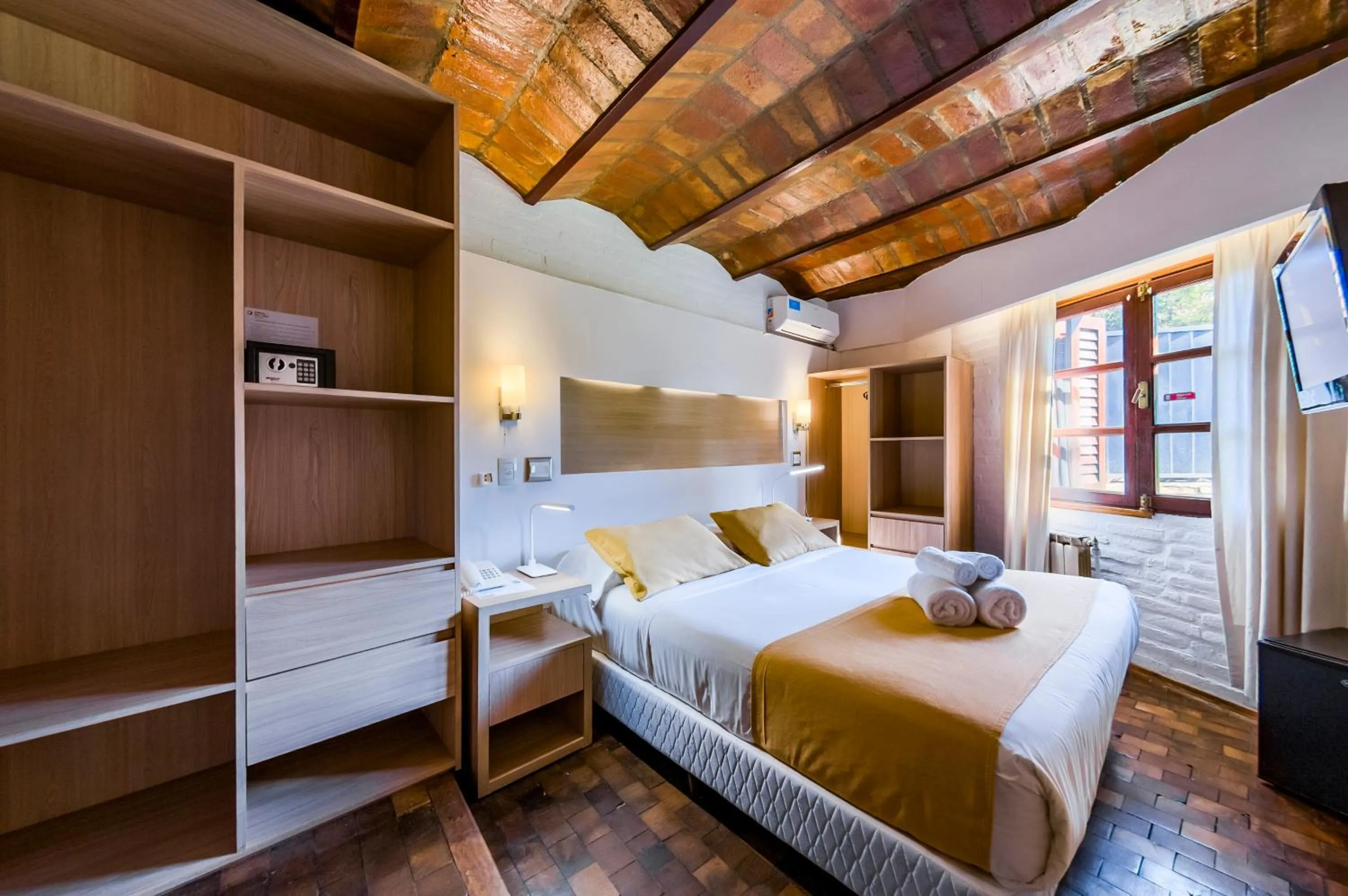 Bed in Portal del Lago Hotel