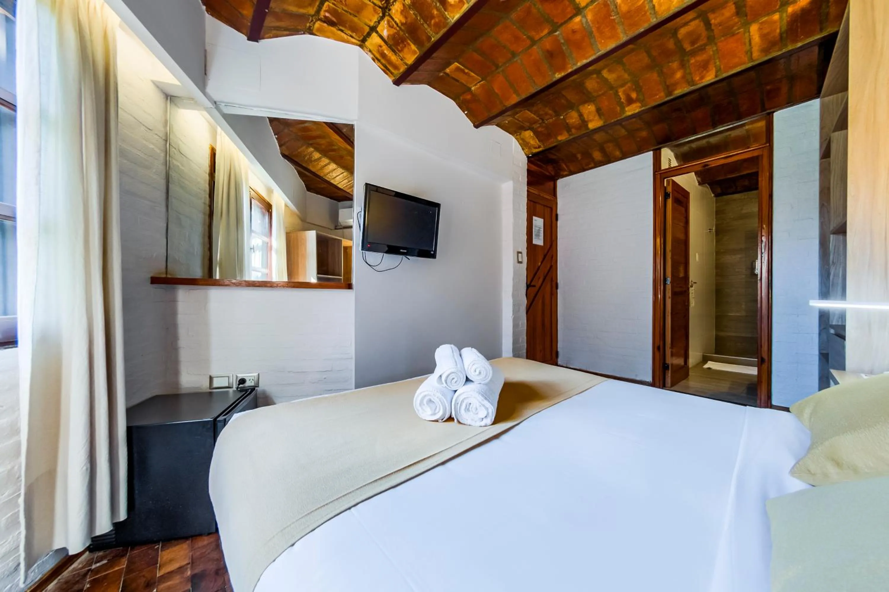 Bed in Portal del Lago Hotel