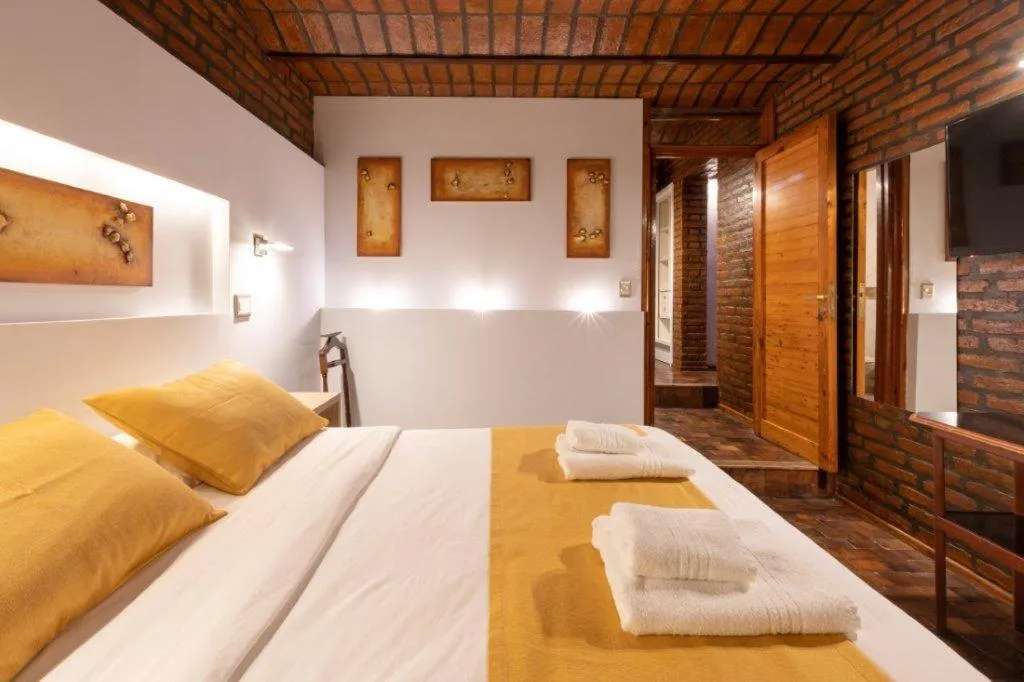 Bed in Portal del Lago Hotel