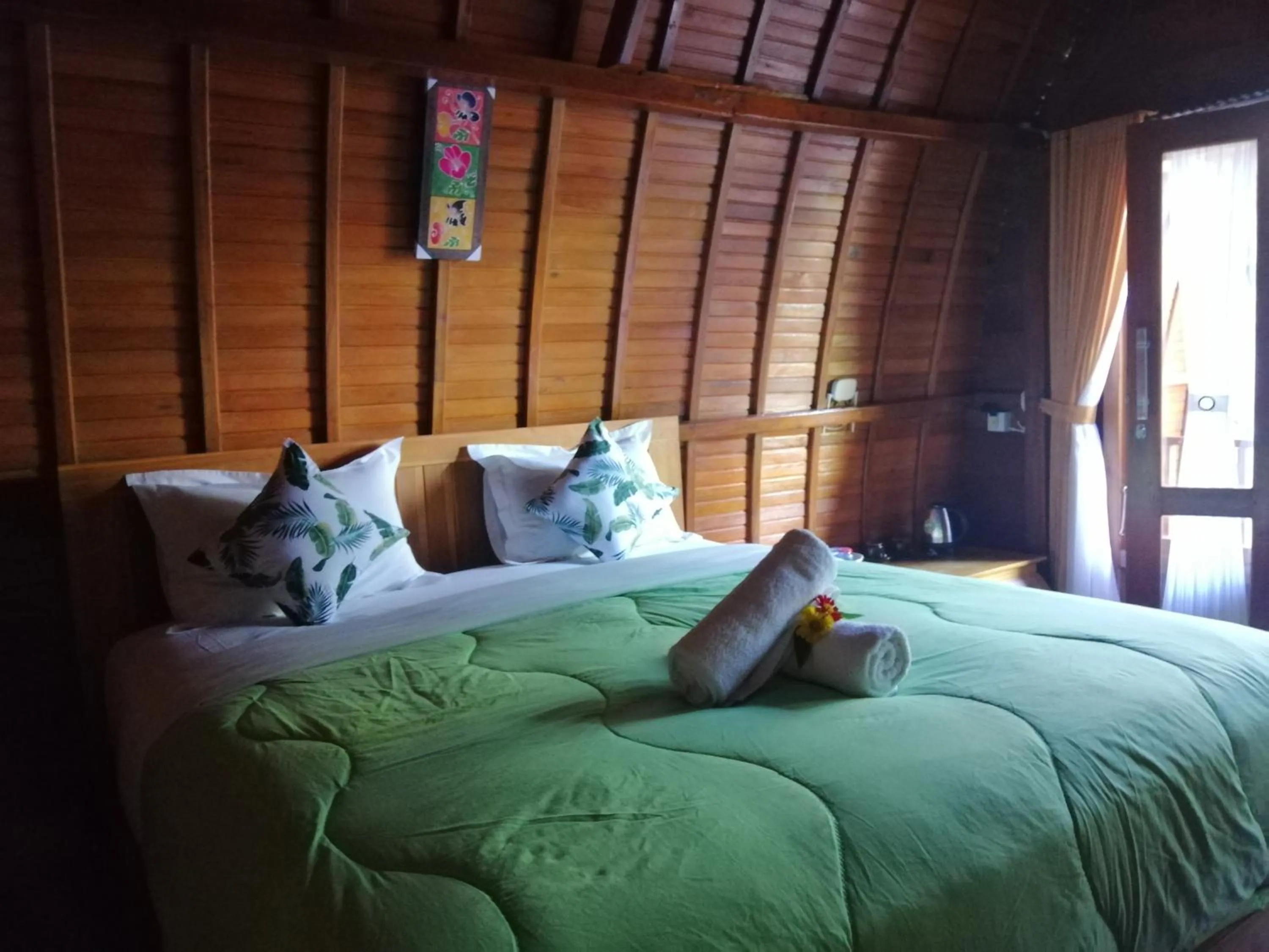 Bed in Ginanthi Cottage