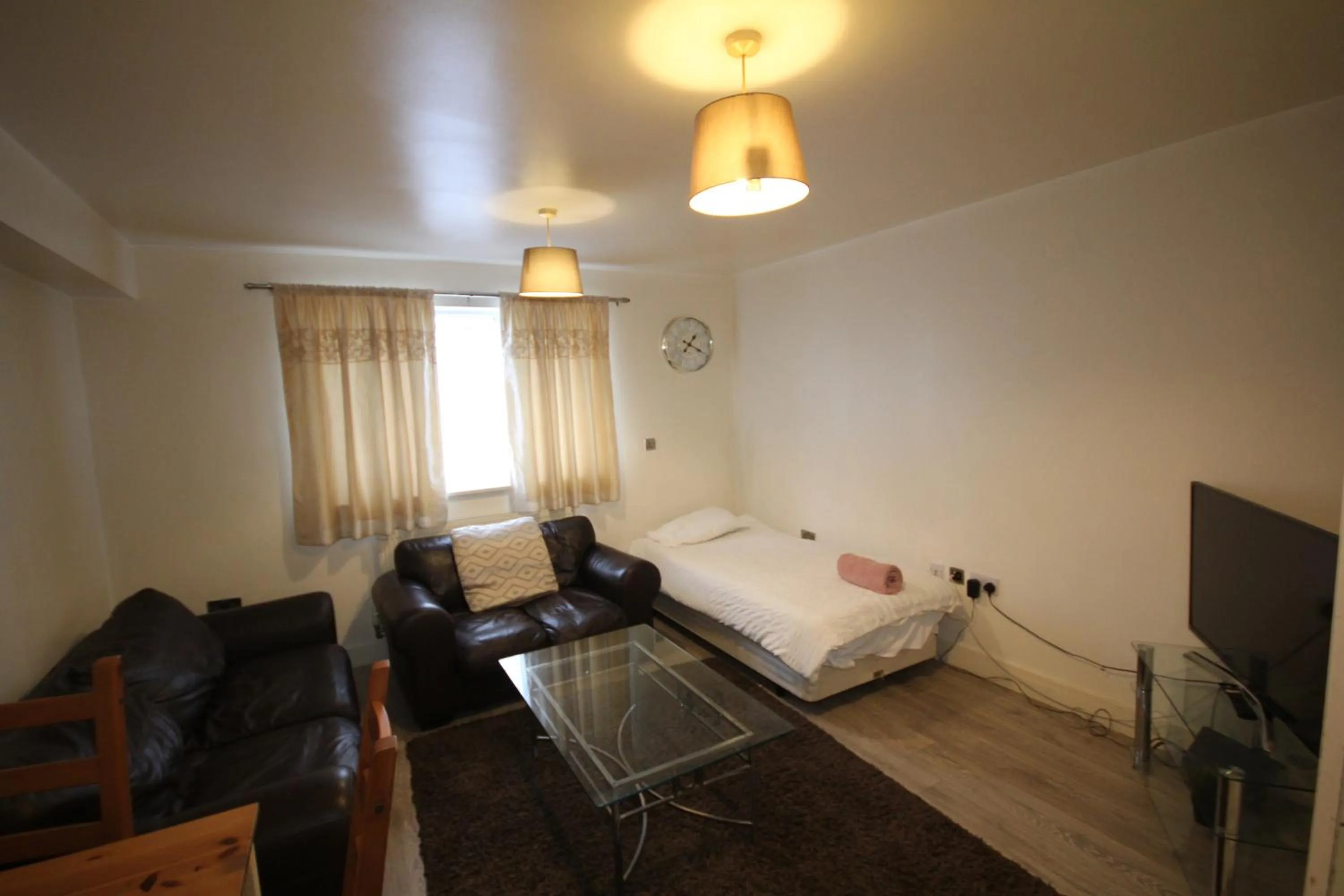 Living room, Bed in Holden Court Apartment - Apt 1