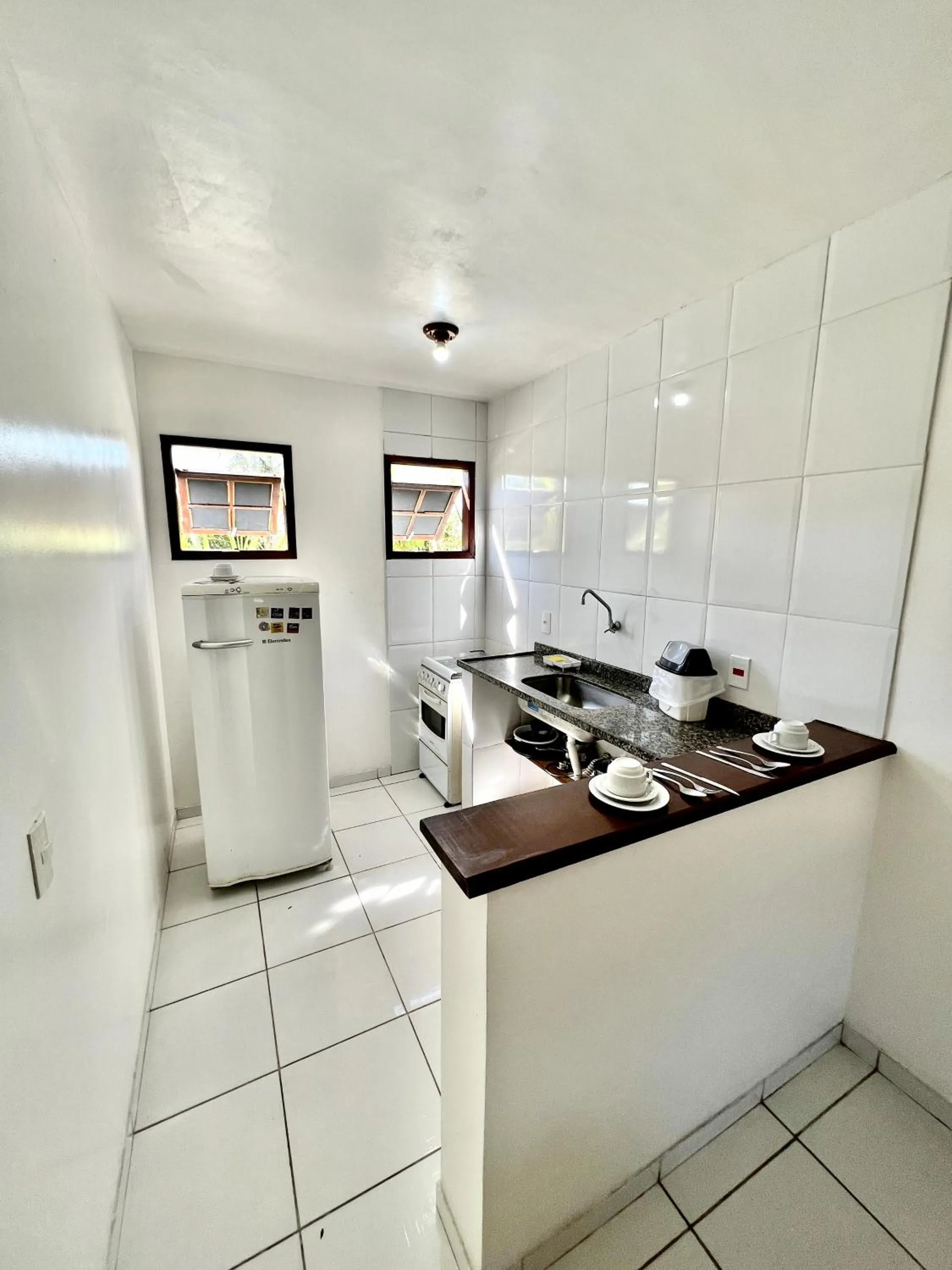 Kitchen or kitchenette in Búzios Flat Pousada