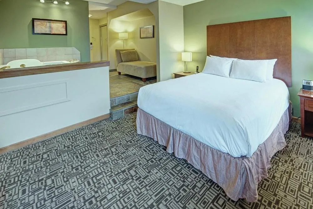 Bed in Mountain Side Hotel Whistler by Executive