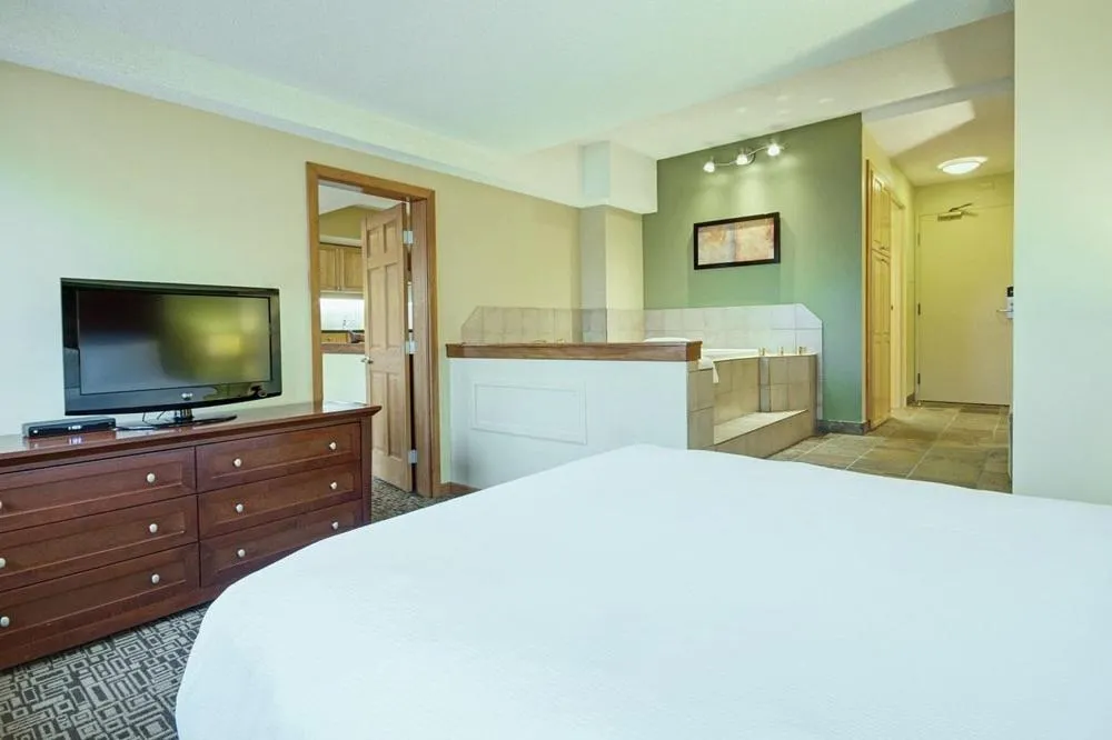 Bed in Mountain Side Hotel Whistler by Executive