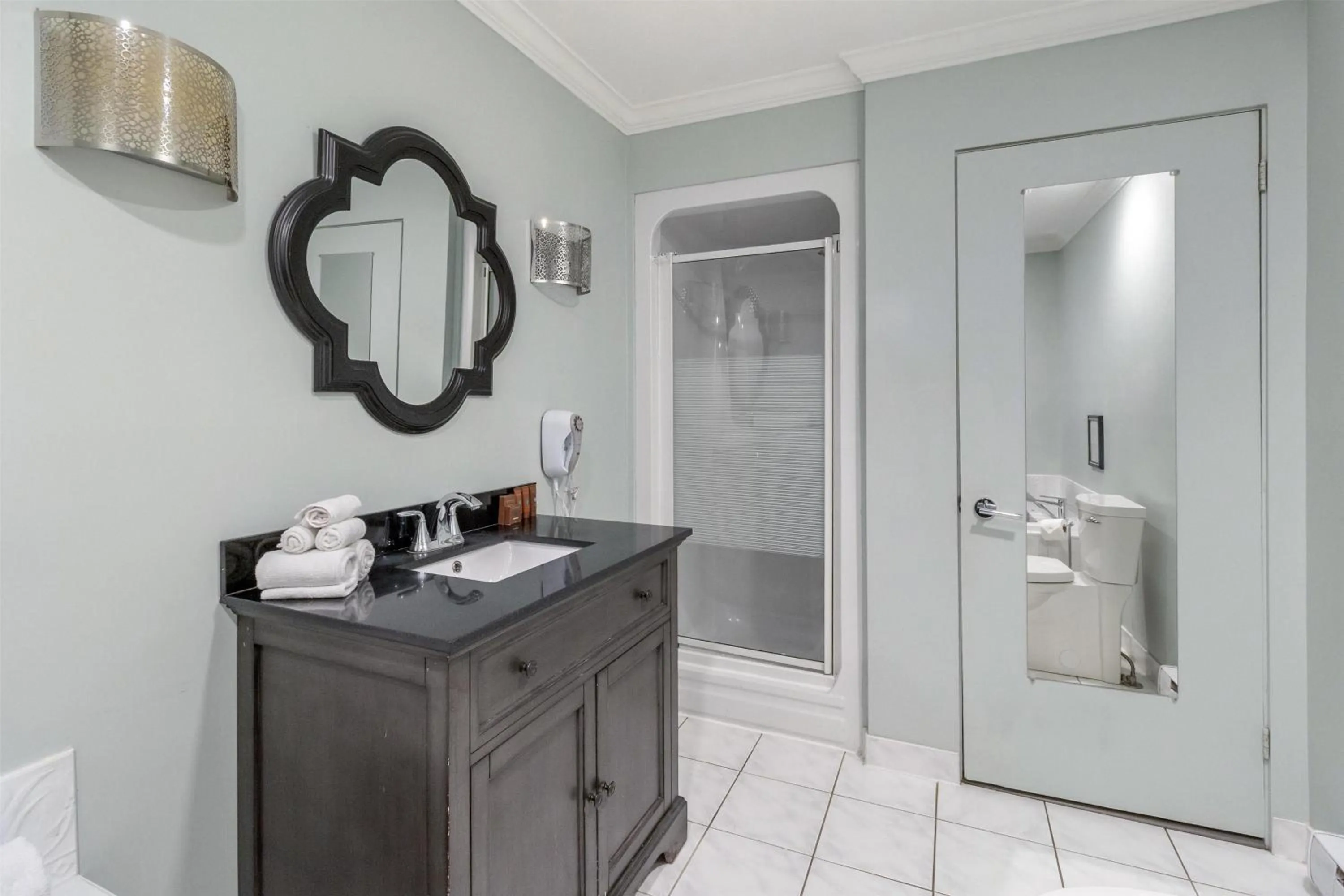 Bathroom in Dannys Suites, SureStay Collection by Best Western