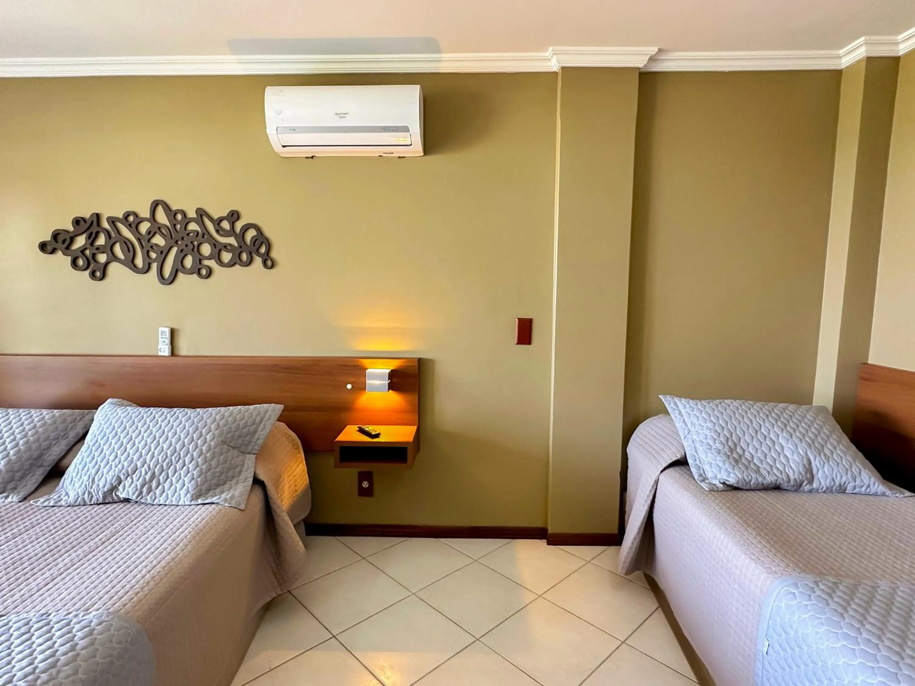 Bed in Pousada Garatéia