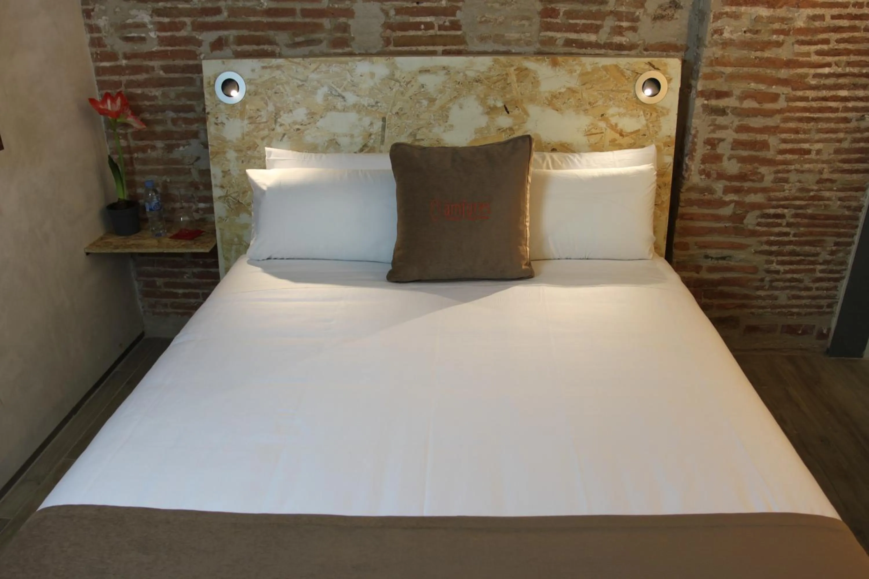 Bed in Àmfores Boutique Guest House
