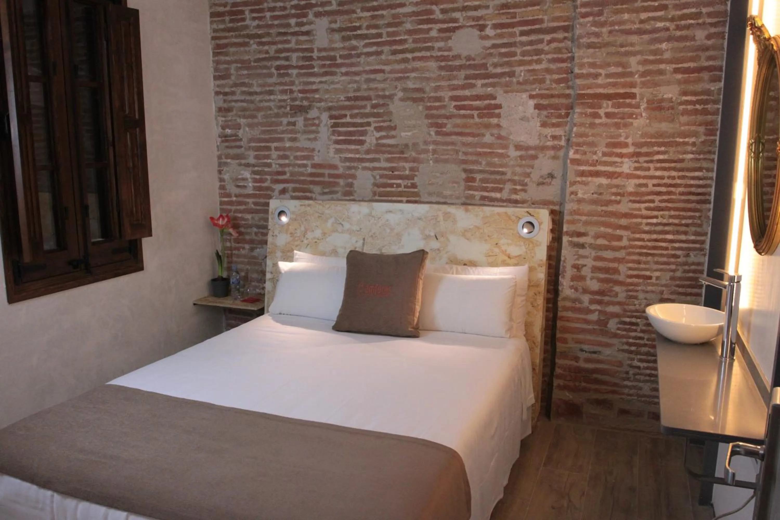 Bed in Àmfores Boutique Guest House
