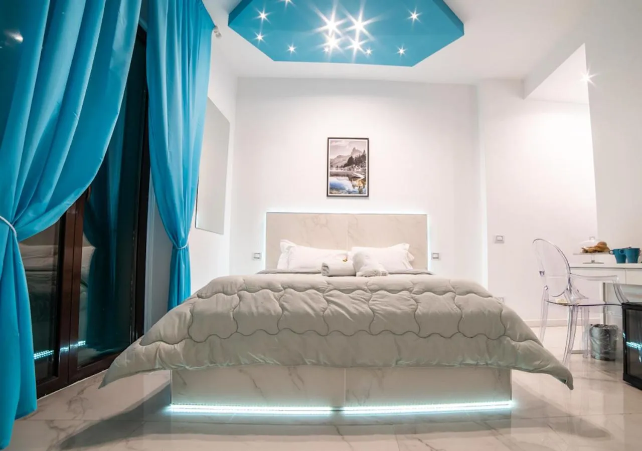 Bed in Tiffany & Babylon Luxury Stay