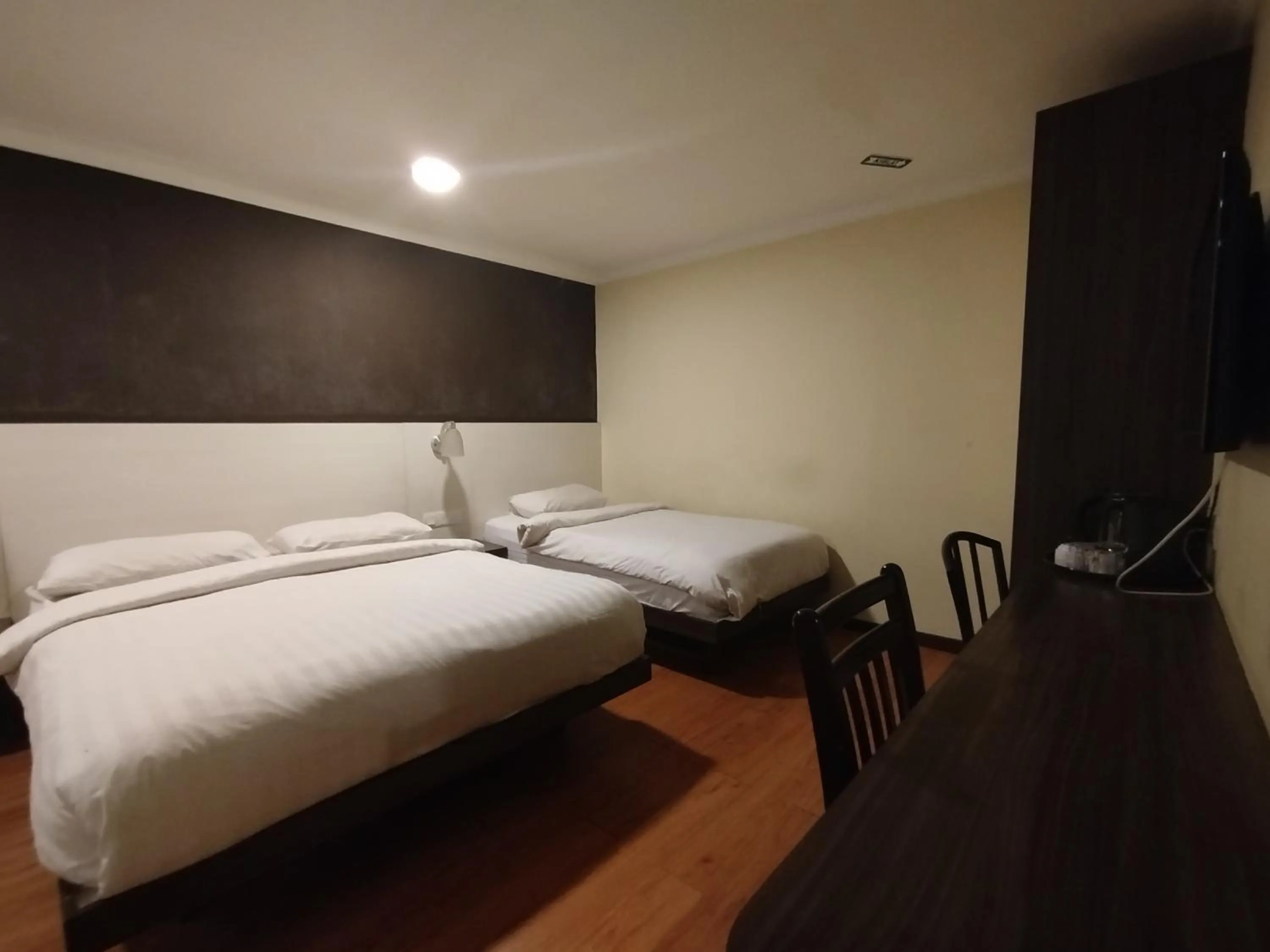 Bed in Hotel De Grand Orchard