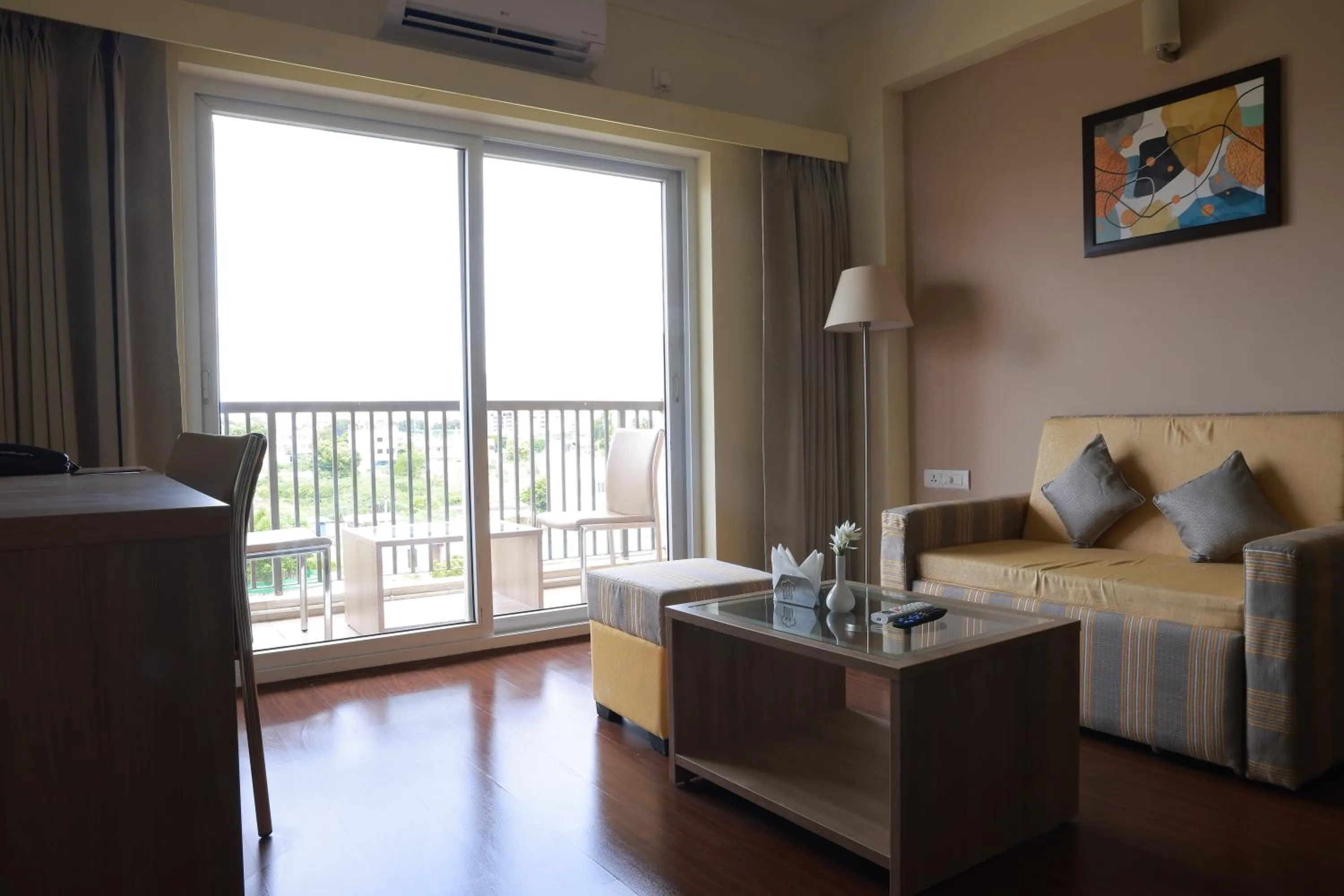 Living room, Bed in Starlit Suites Tirupati