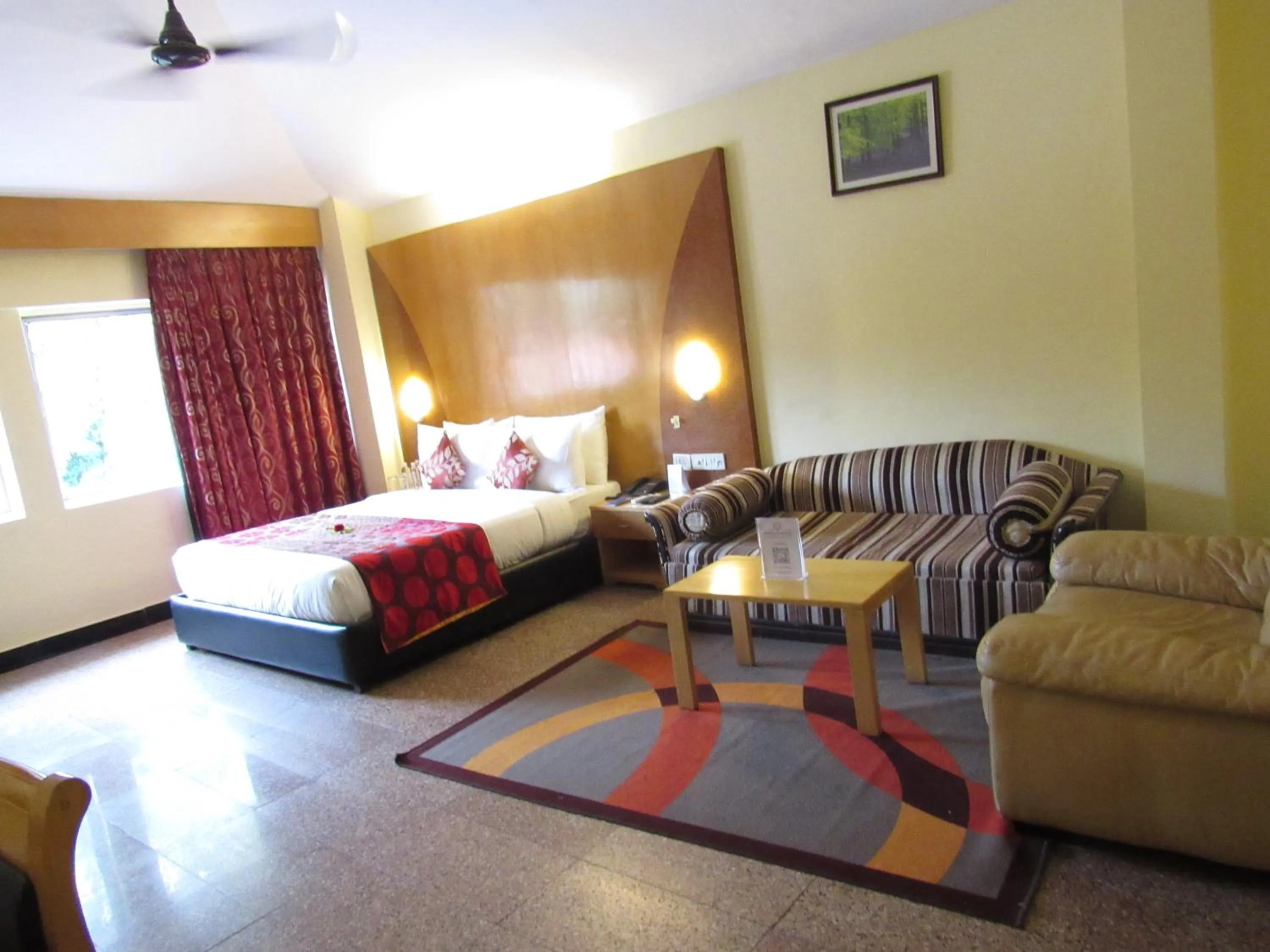 Photo of the whole room, Bed in Ramanashree California Resort