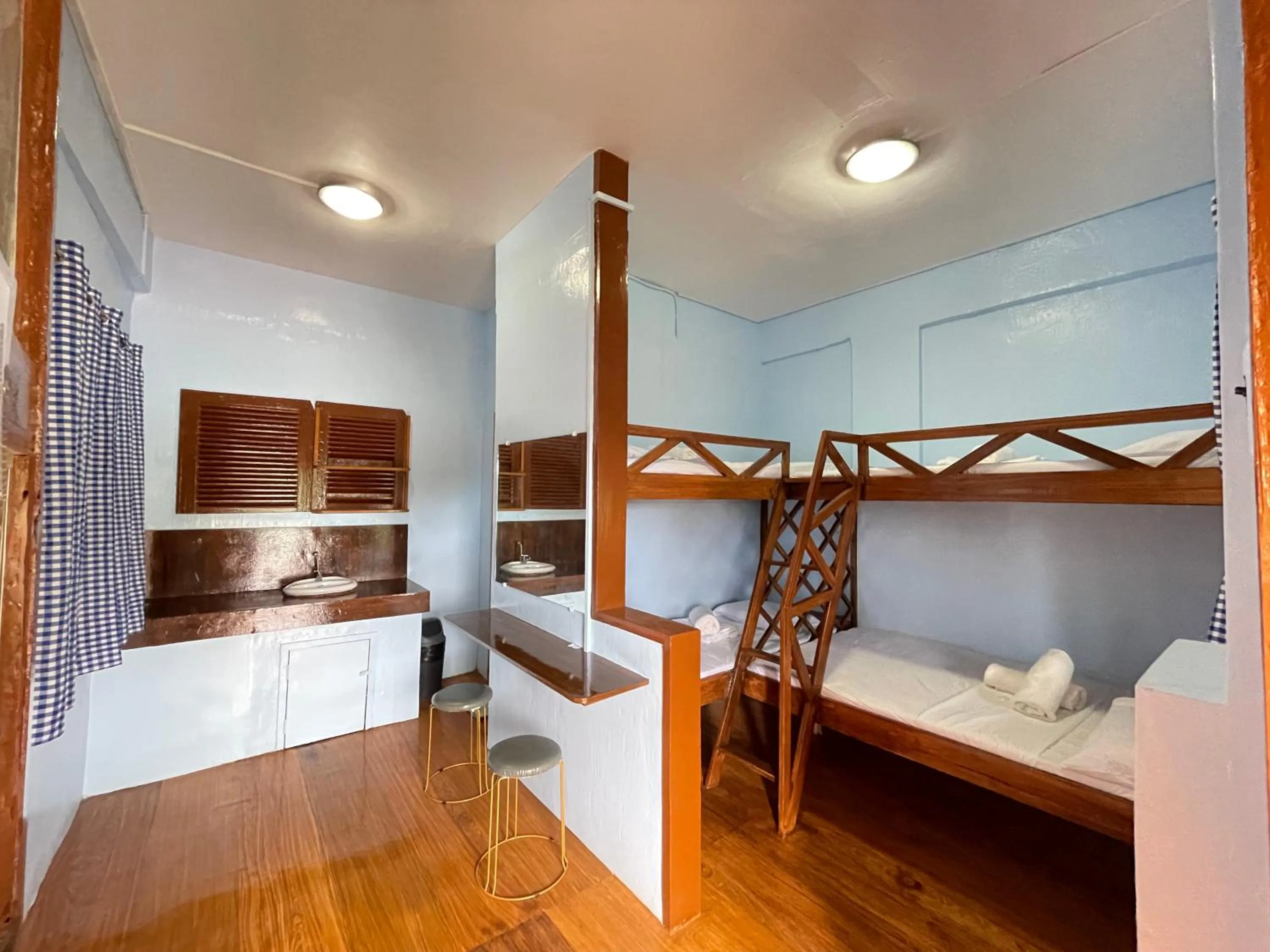 Bed in Camiguin Blue Lagoon Cottages