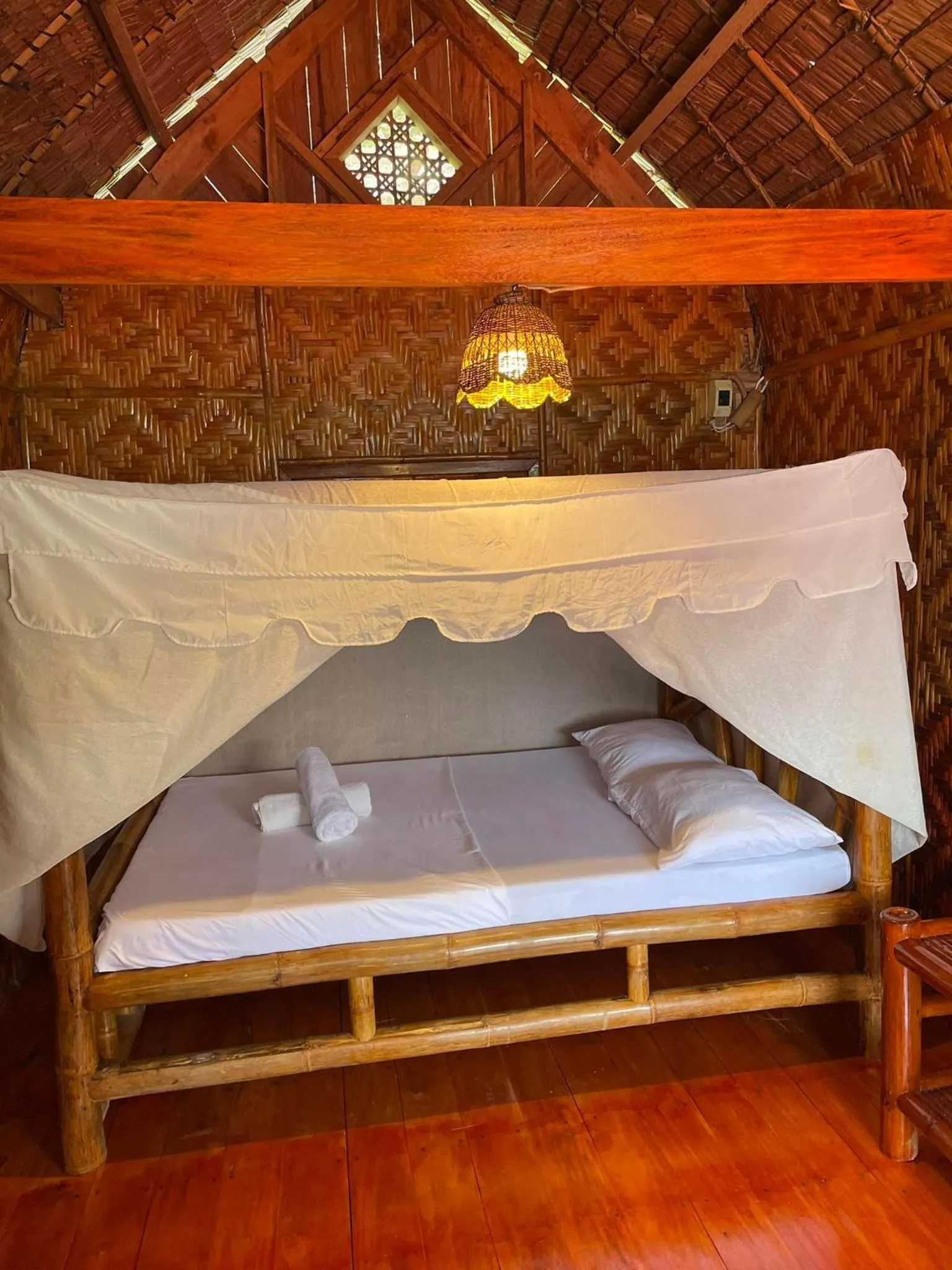 Bed in Camiguin Blue Lagoon Cottages