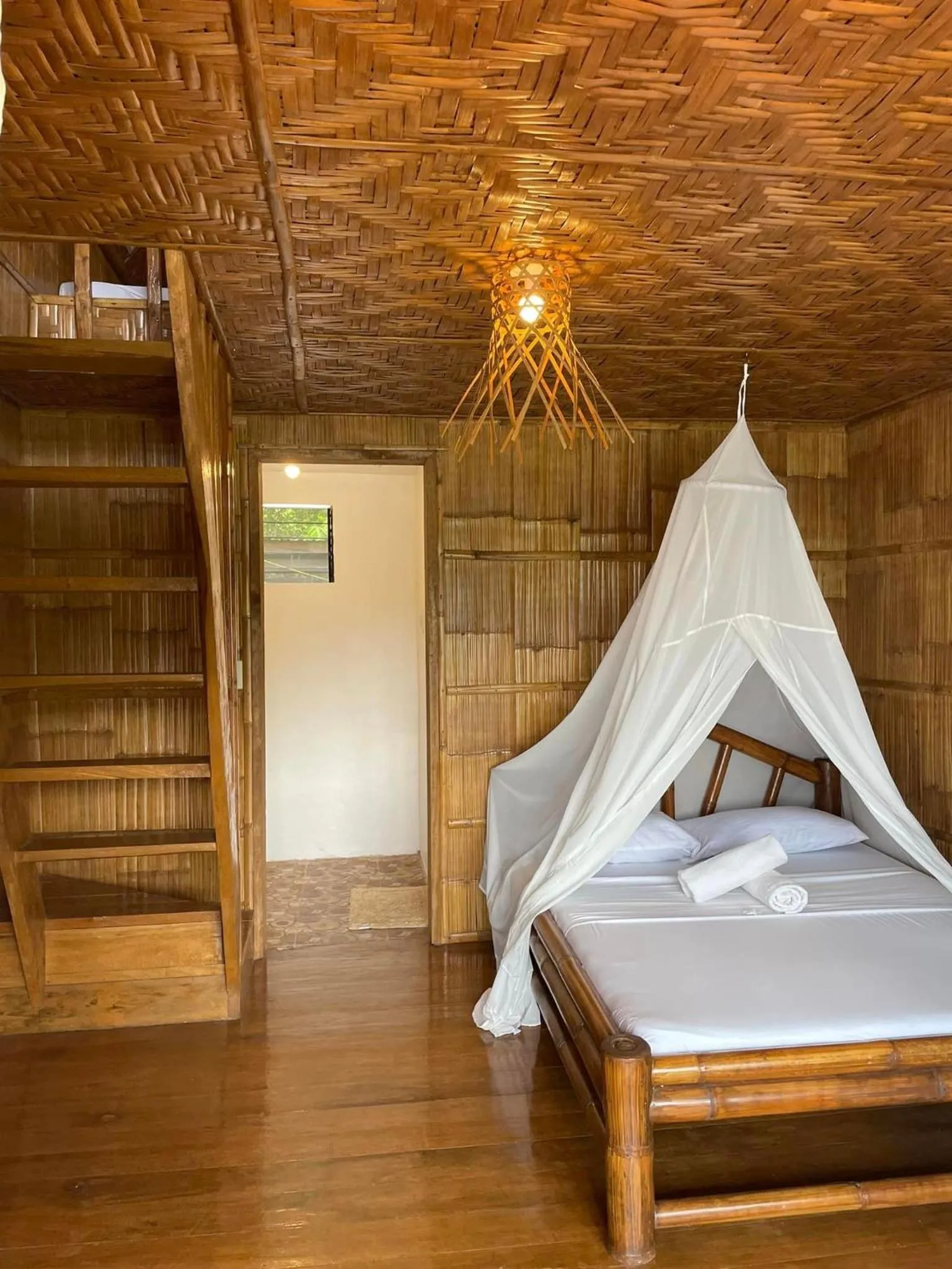 Bed in Camiguin Blue Lagoon Cottages