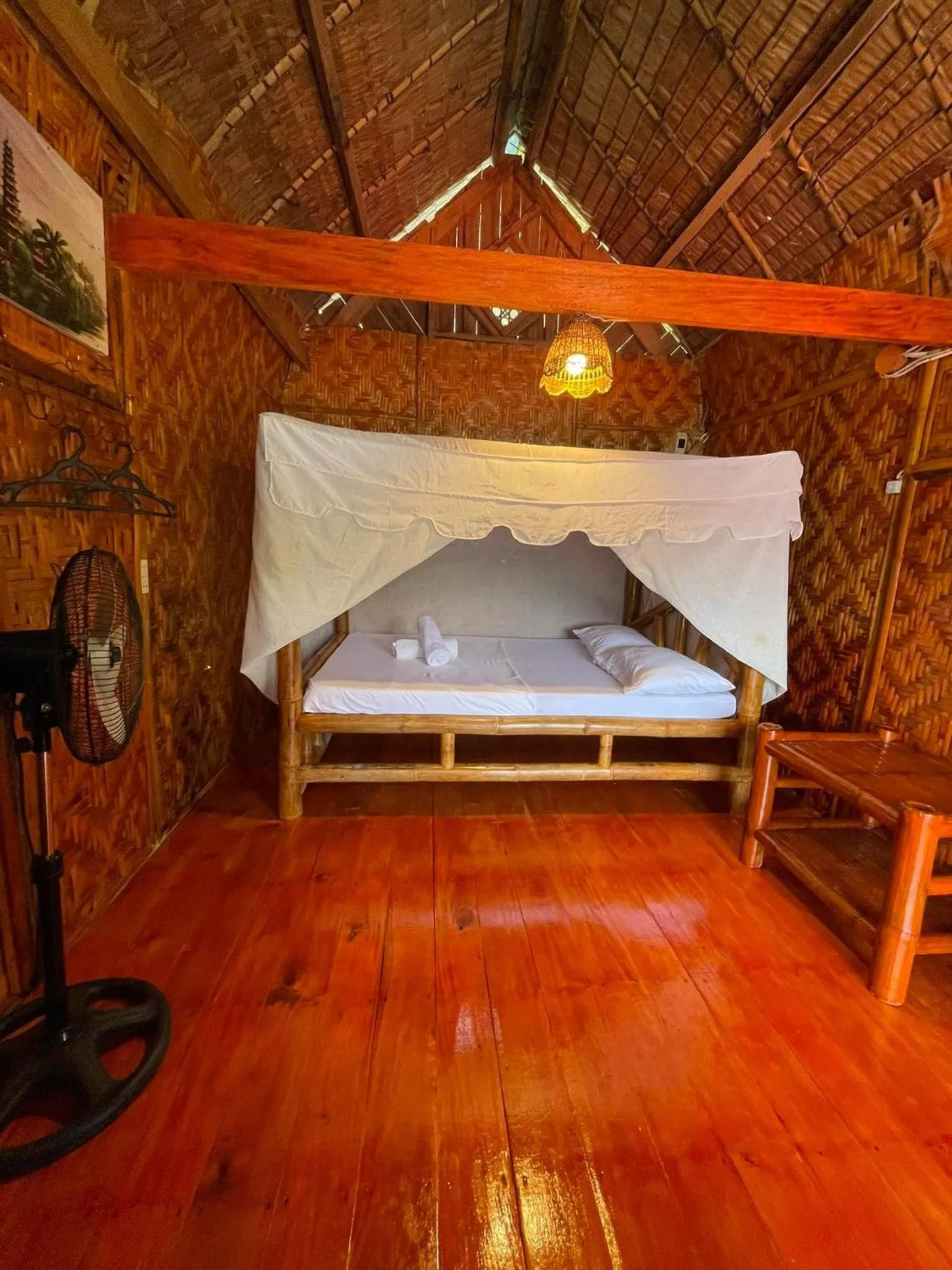 Bed in Camiguin Blue Lagoon Cottages