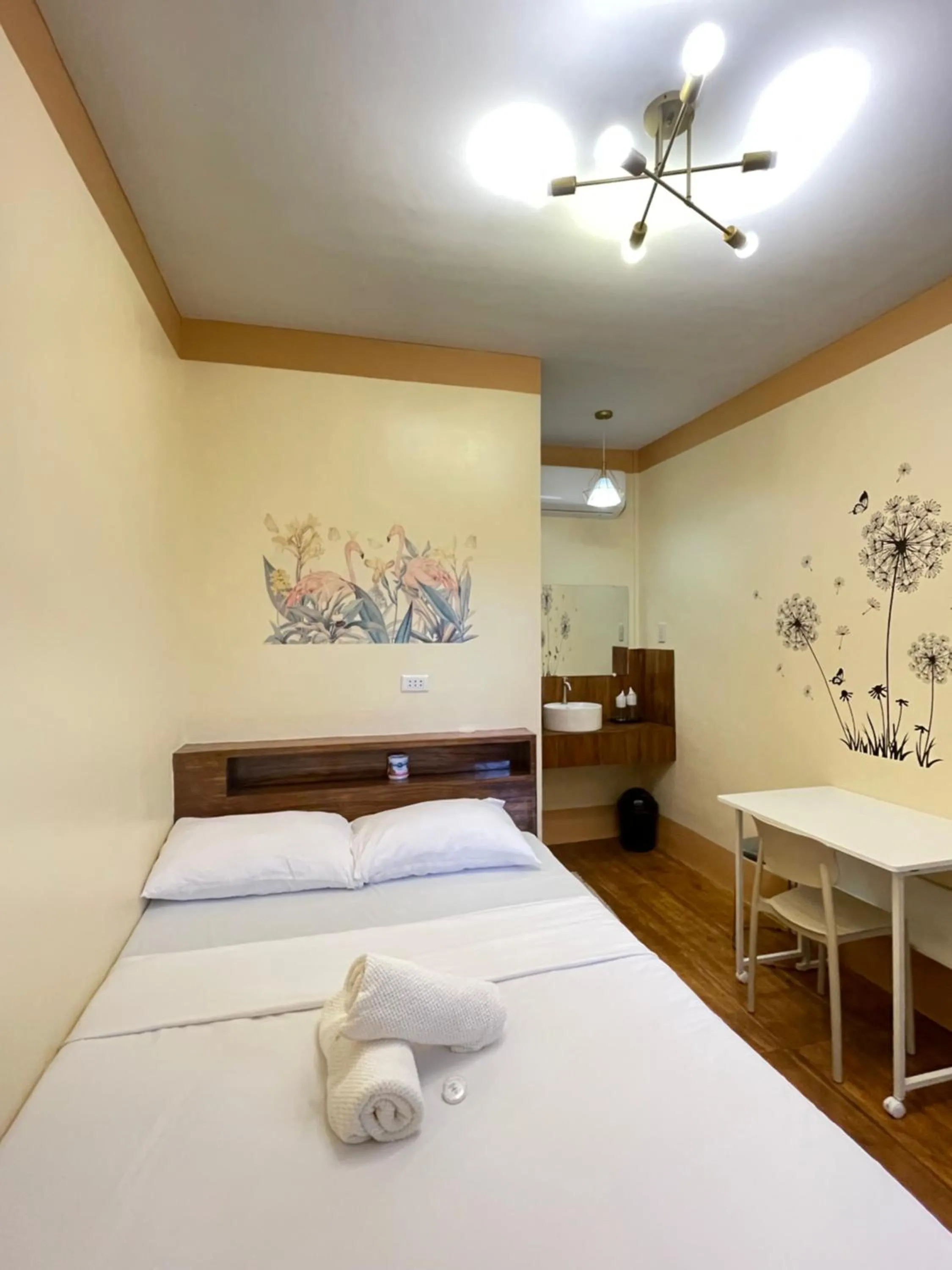 Bed in Camiguin Blue Lagoon Cottages