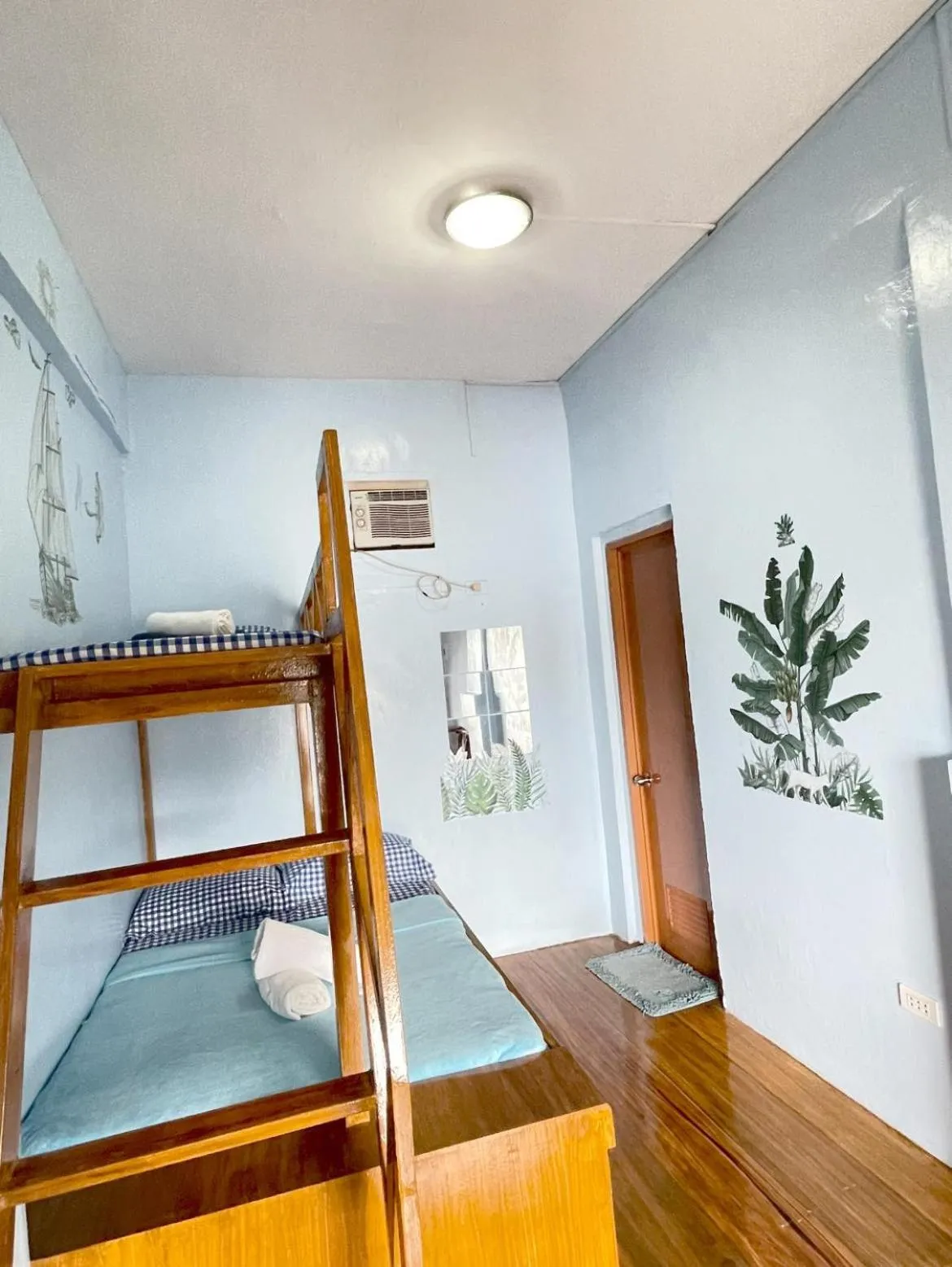 Bed in Camiguin Blue Lagoon Cottages