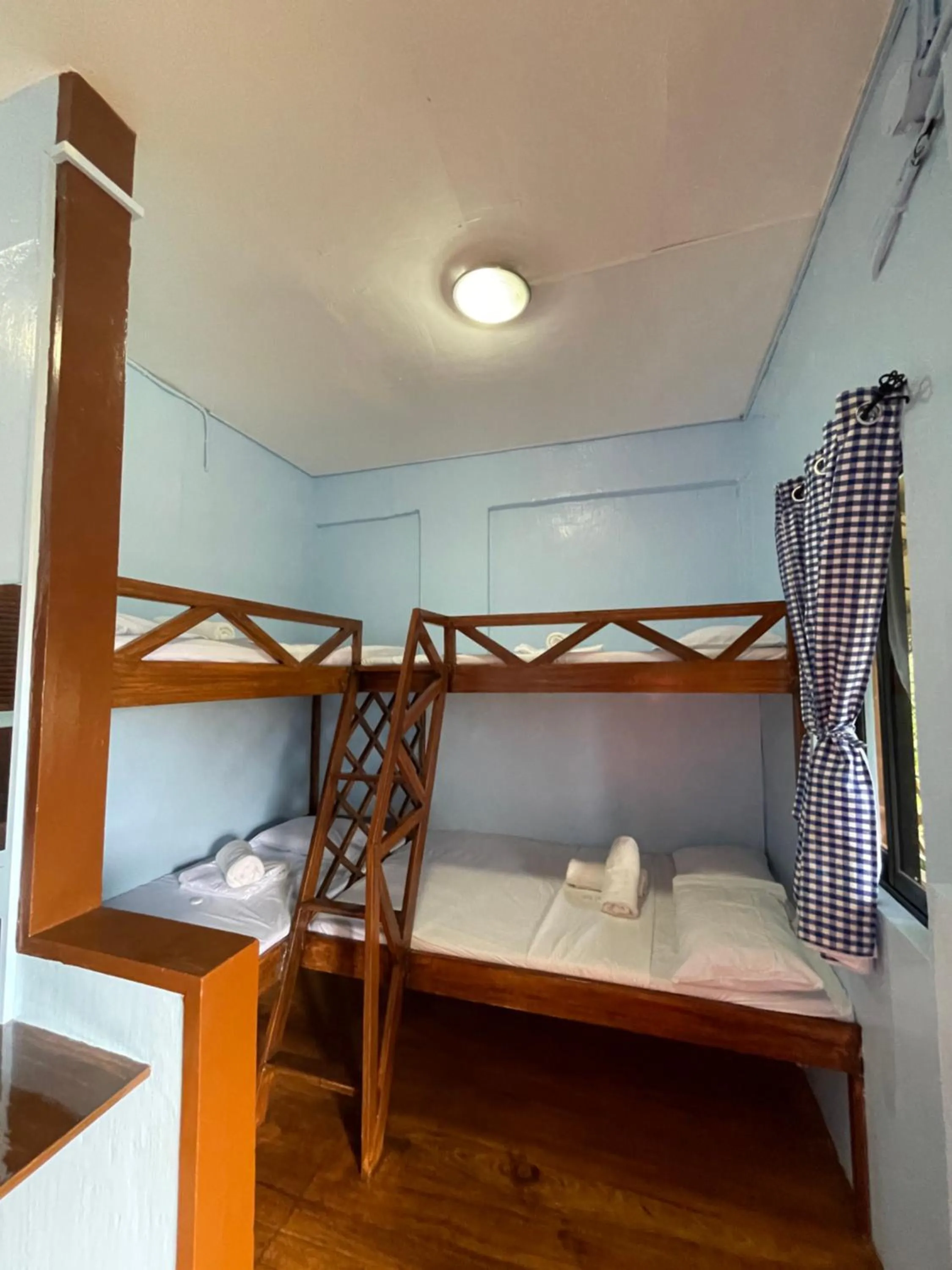 Bed in Camiguin Blue Lagoon Cottages