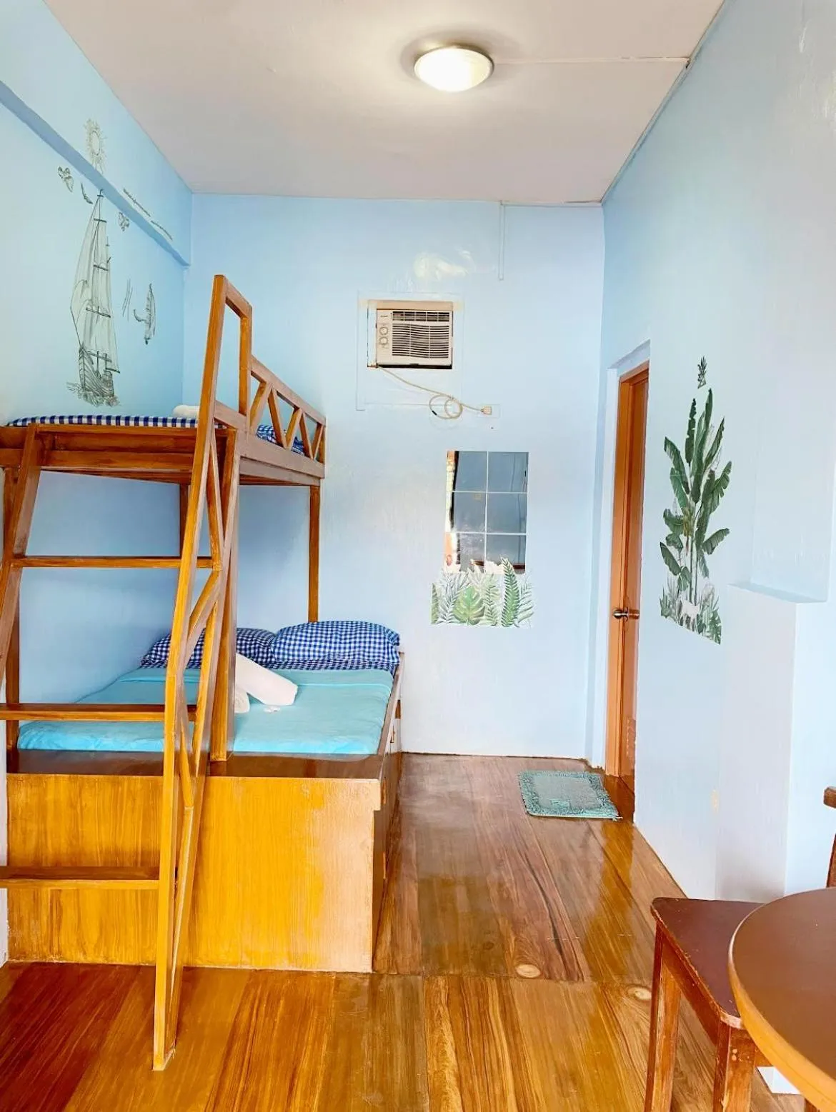 Bed in Camiguin Blue Lagoon Cottages
