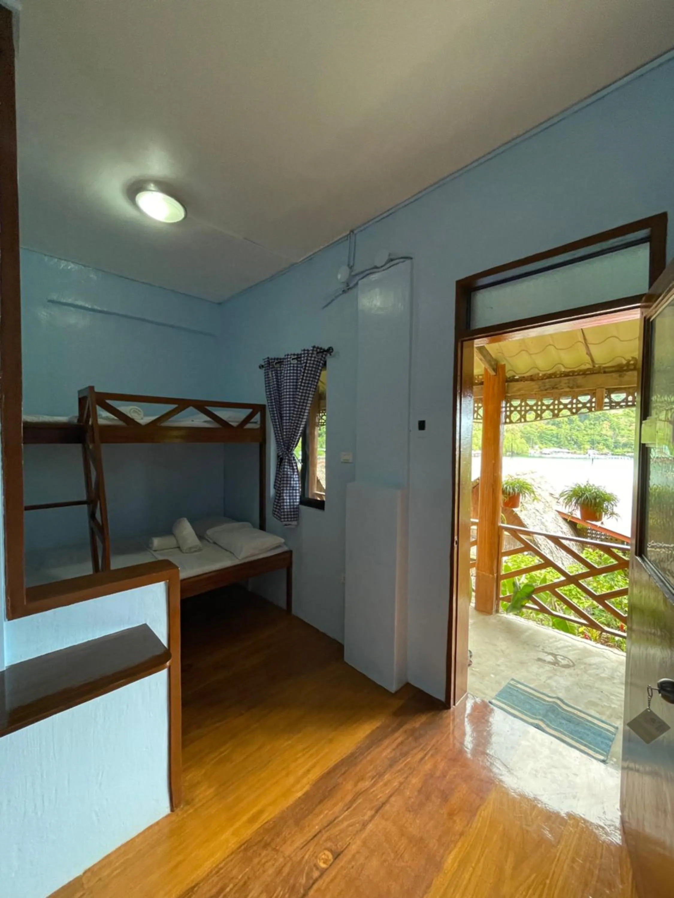 Bed in Camiguin Blue Lagoon Cottages