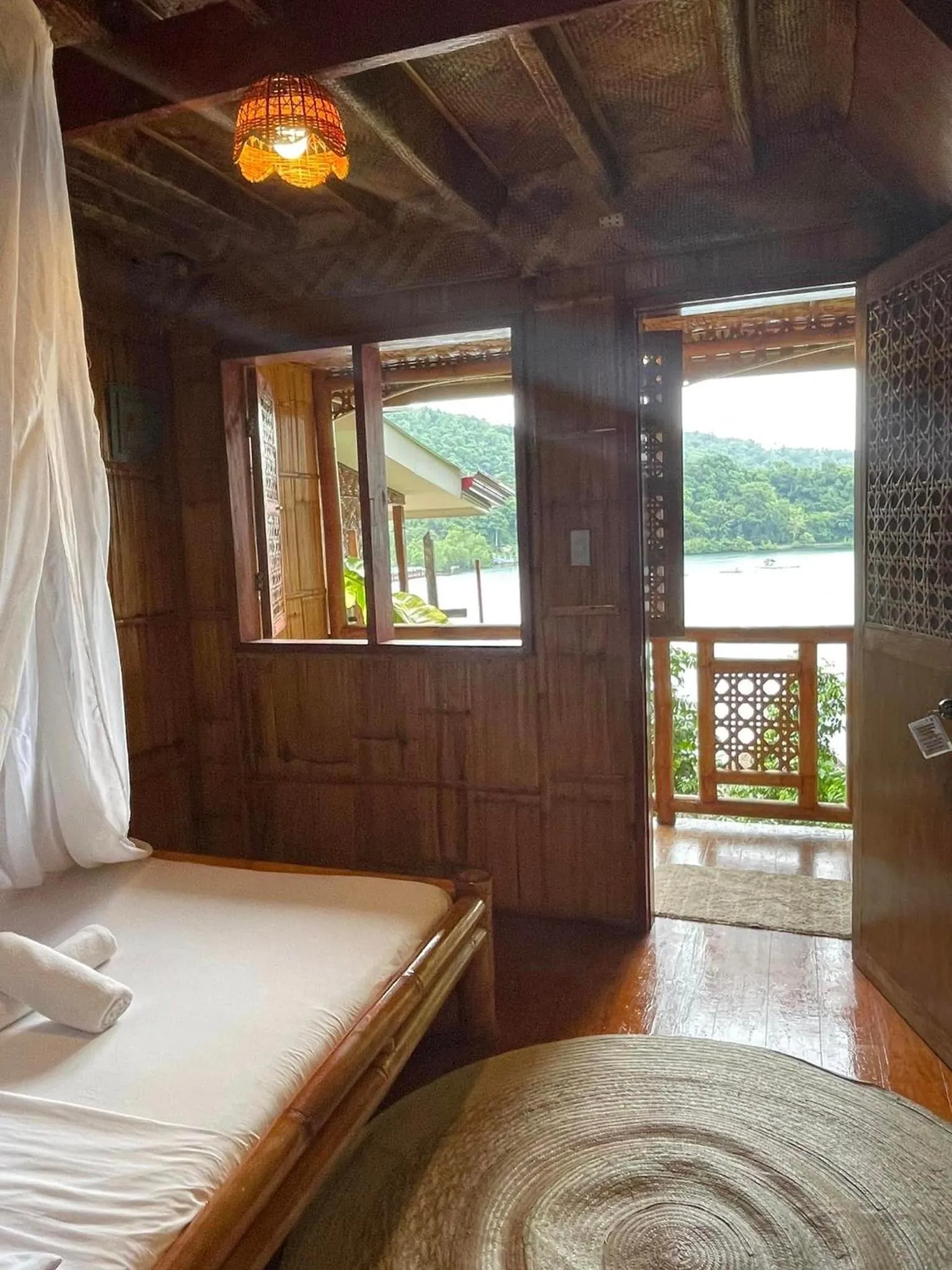 Bed in Camiguin Blue Lagoon Cottages