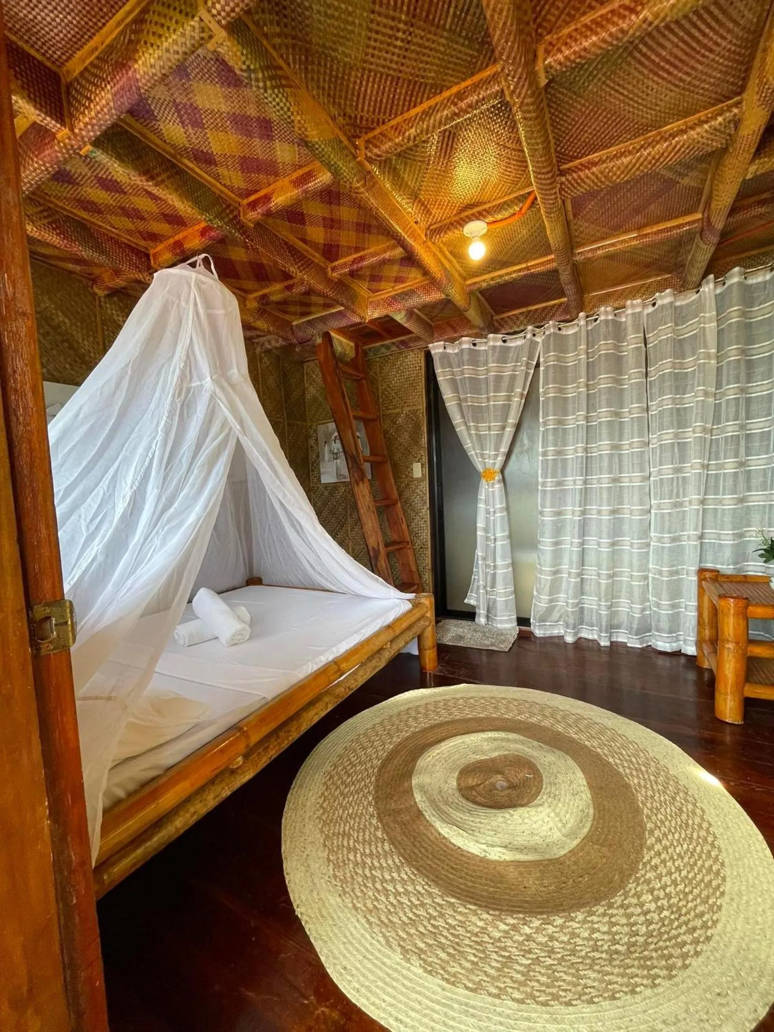 Bed in Camiguin Blue Lagoon Cottages