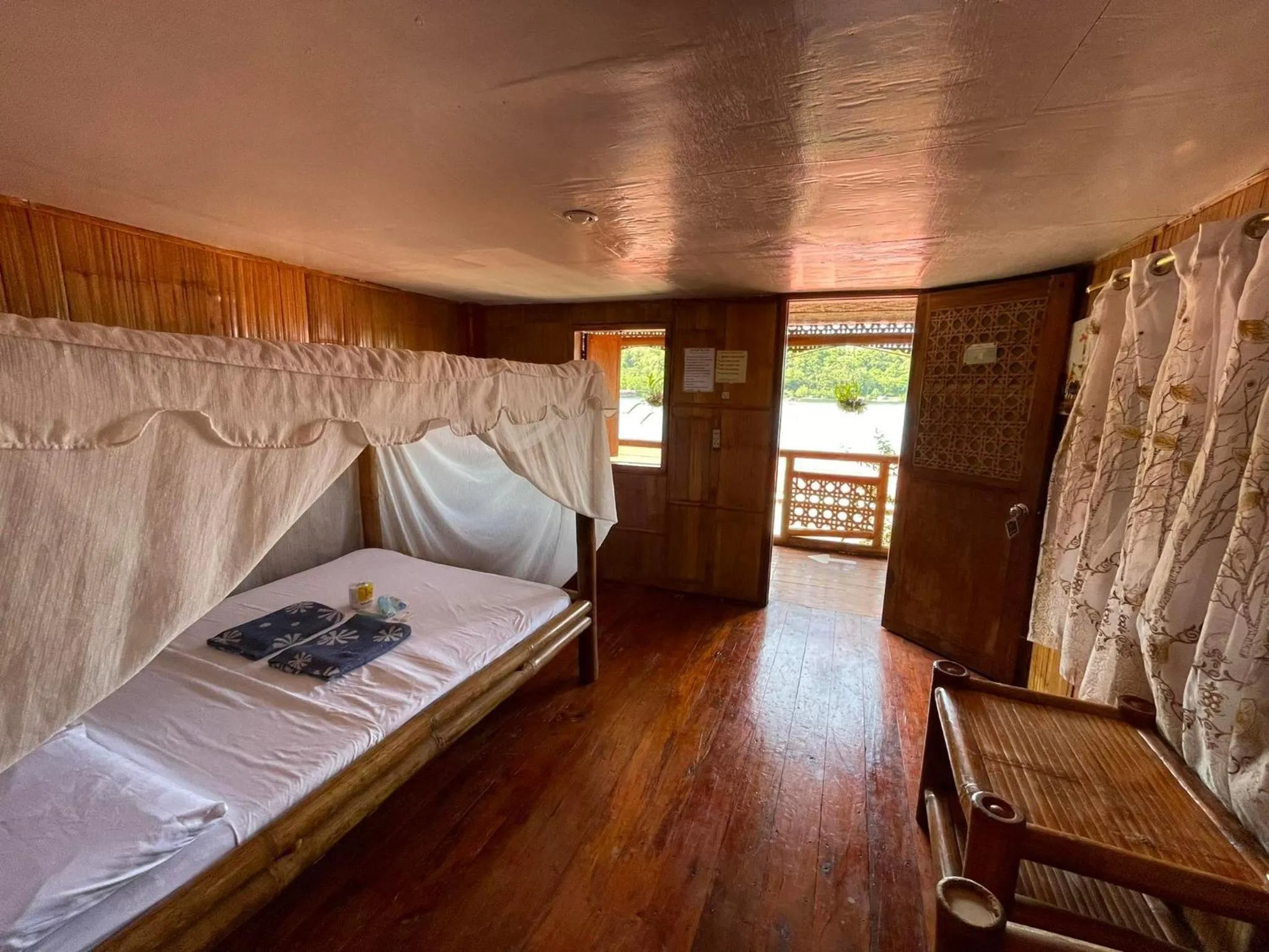 Bed in Camiguin Blue Lagoon Cottages