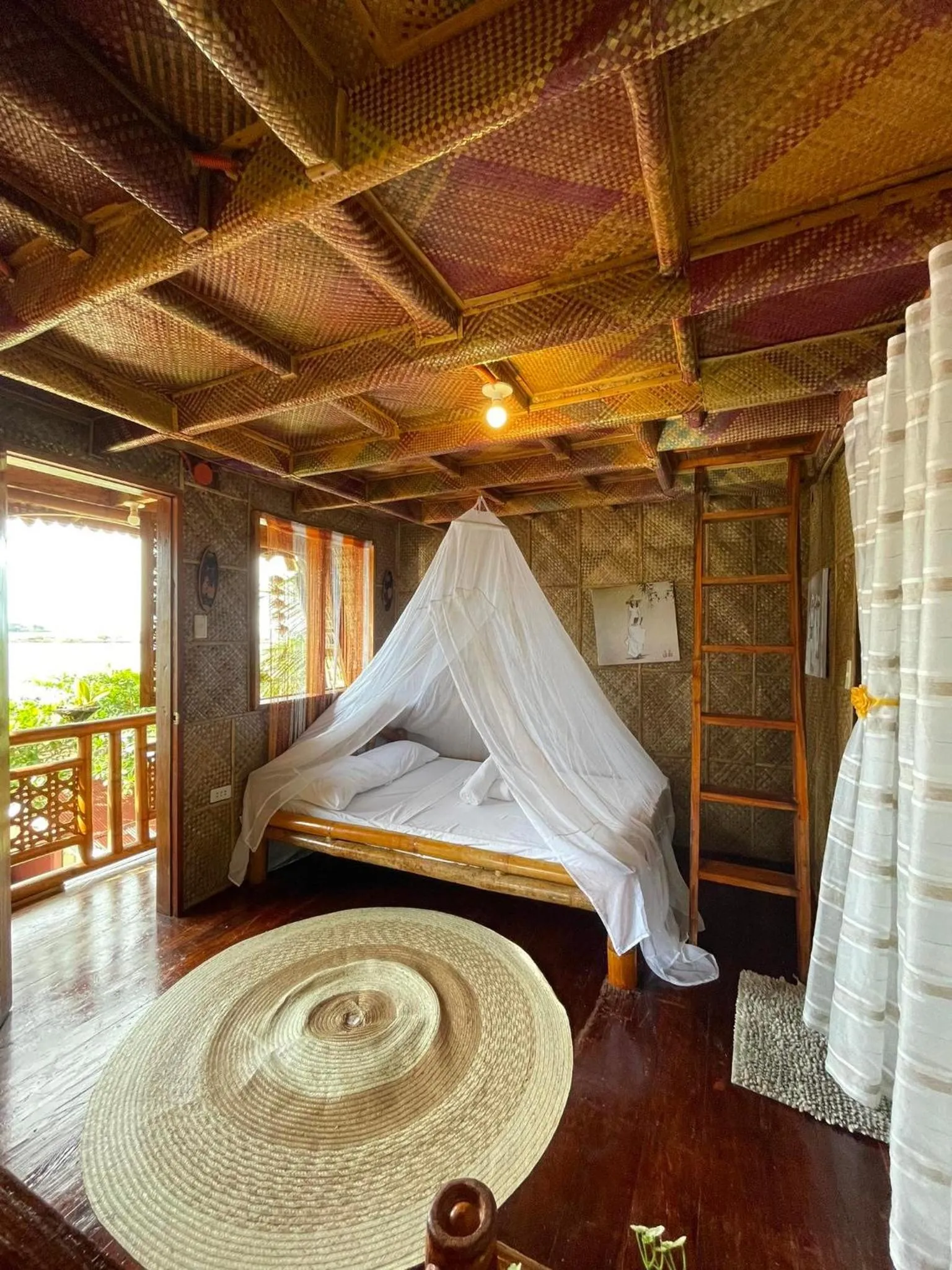 Bed in Camiguin Blue Lagoon Cottages