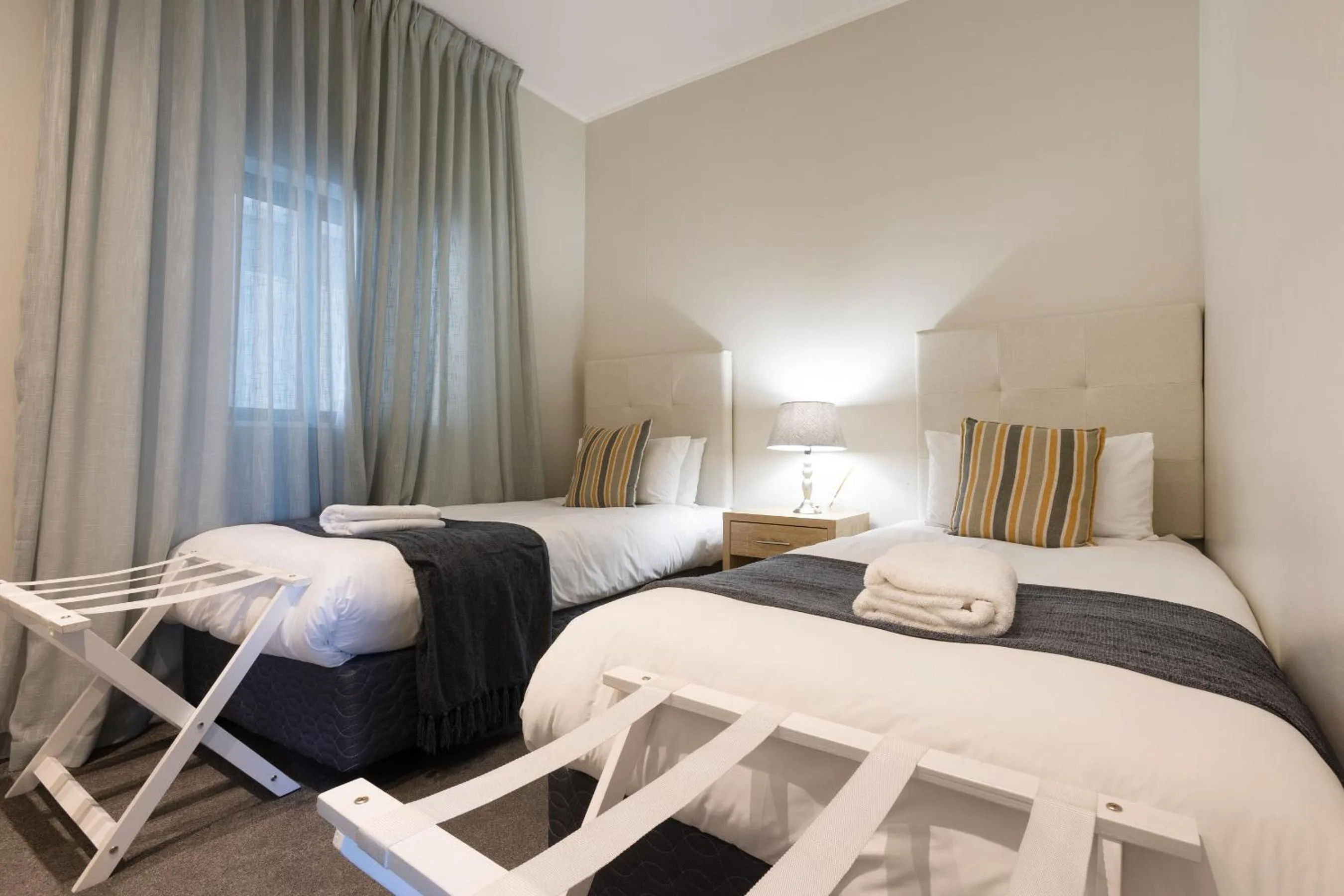 Bed in Axis Luxury Apartments by Century City Hotels