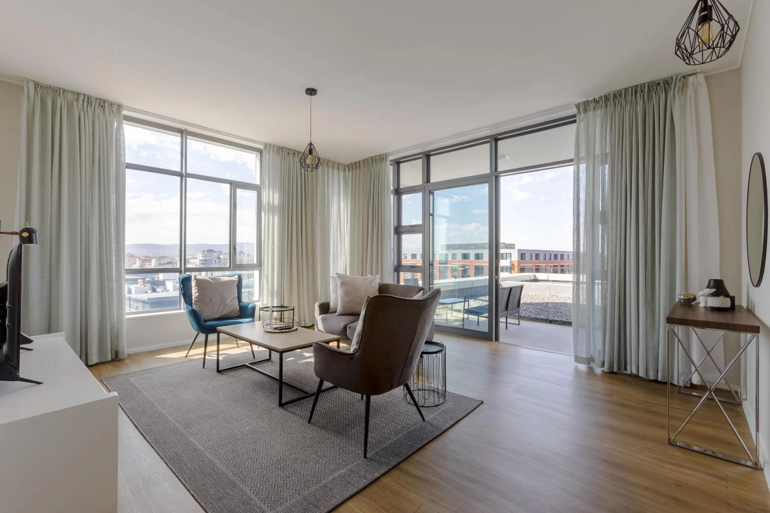 Living room in Axis Luxury Apartments by Century City Hotels