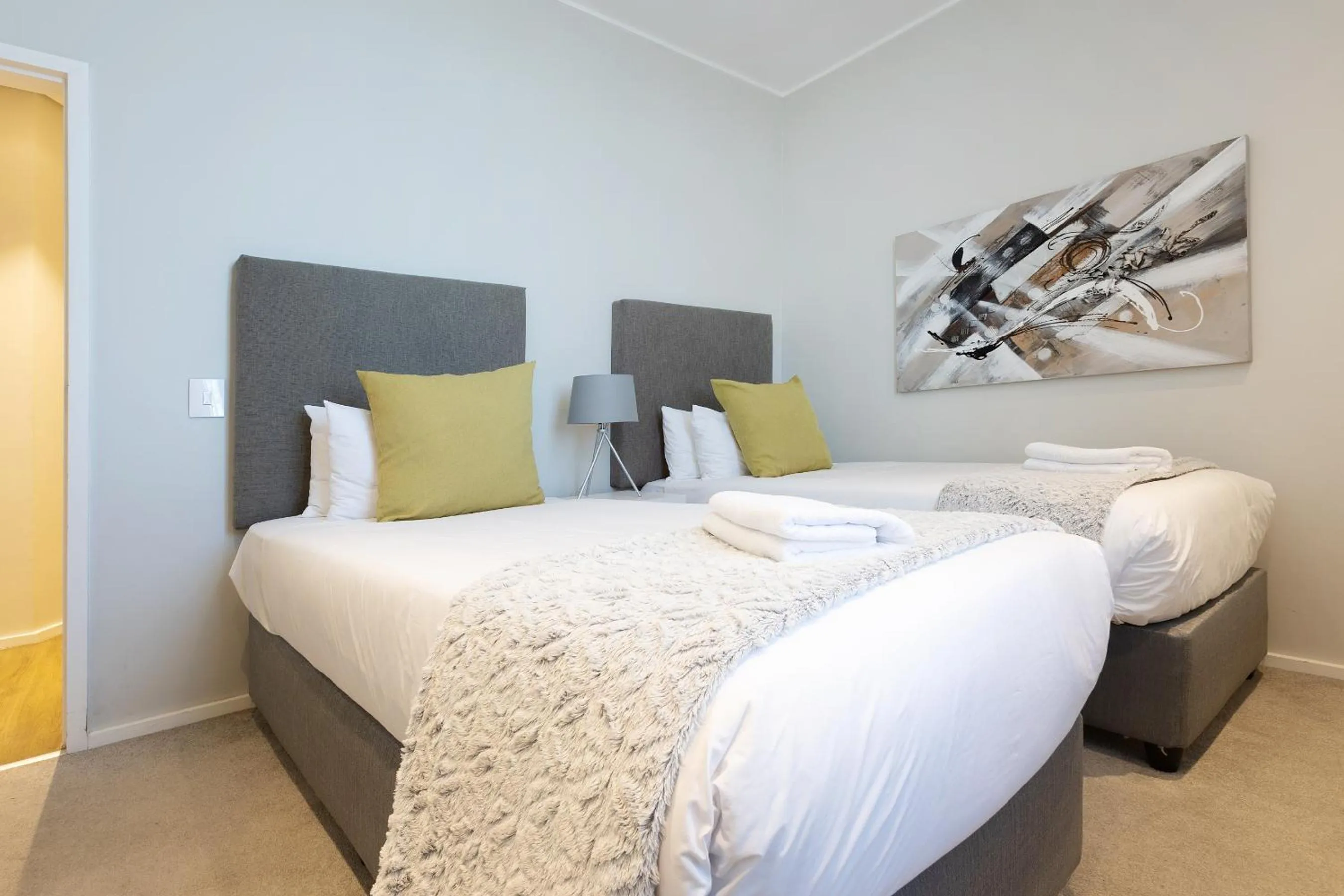 Bed in Axis Luxury Apartments by Century City Hotels